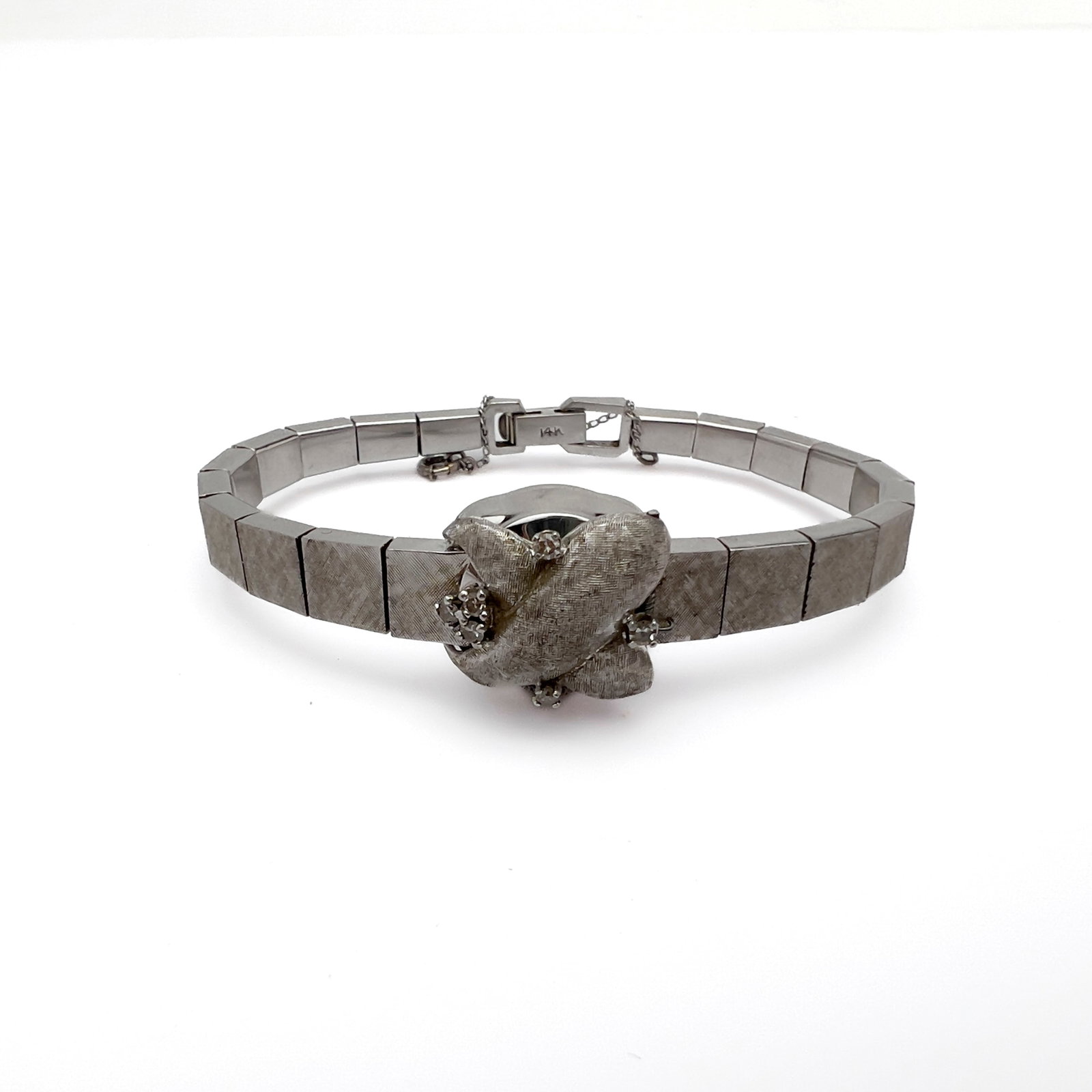 A Ladies Mid-Century Rubros 14k White Gold and Diamond Cocktail Watch: Lot 144 A Ladies Mid-Century Rubros 14k White Gold and Diamond Cocktail Watch (circa 1950) 14k white gold, diamond stamped Description: A ladies mid-century Swiss mechanical dress cocktail watch, the 