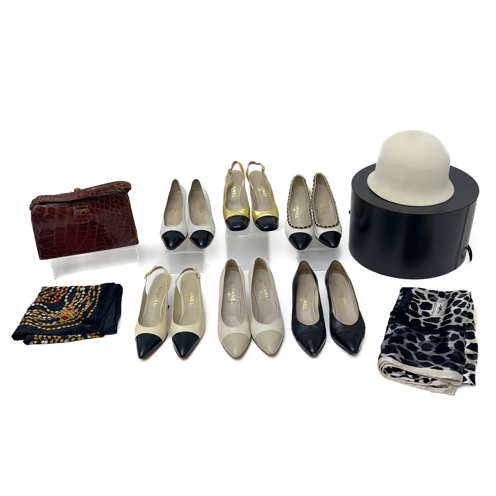Chanel - Hat, Shoes and Other Designer Pieces: Lot 167 Chanel French Manufacturer (Founded 1910) Hat, Shoes and Other Designer Pieces Crocodile Leather, Calfskin Leather, Brass, Silk, Wool labeled Description: An assembled luxury fashion group co