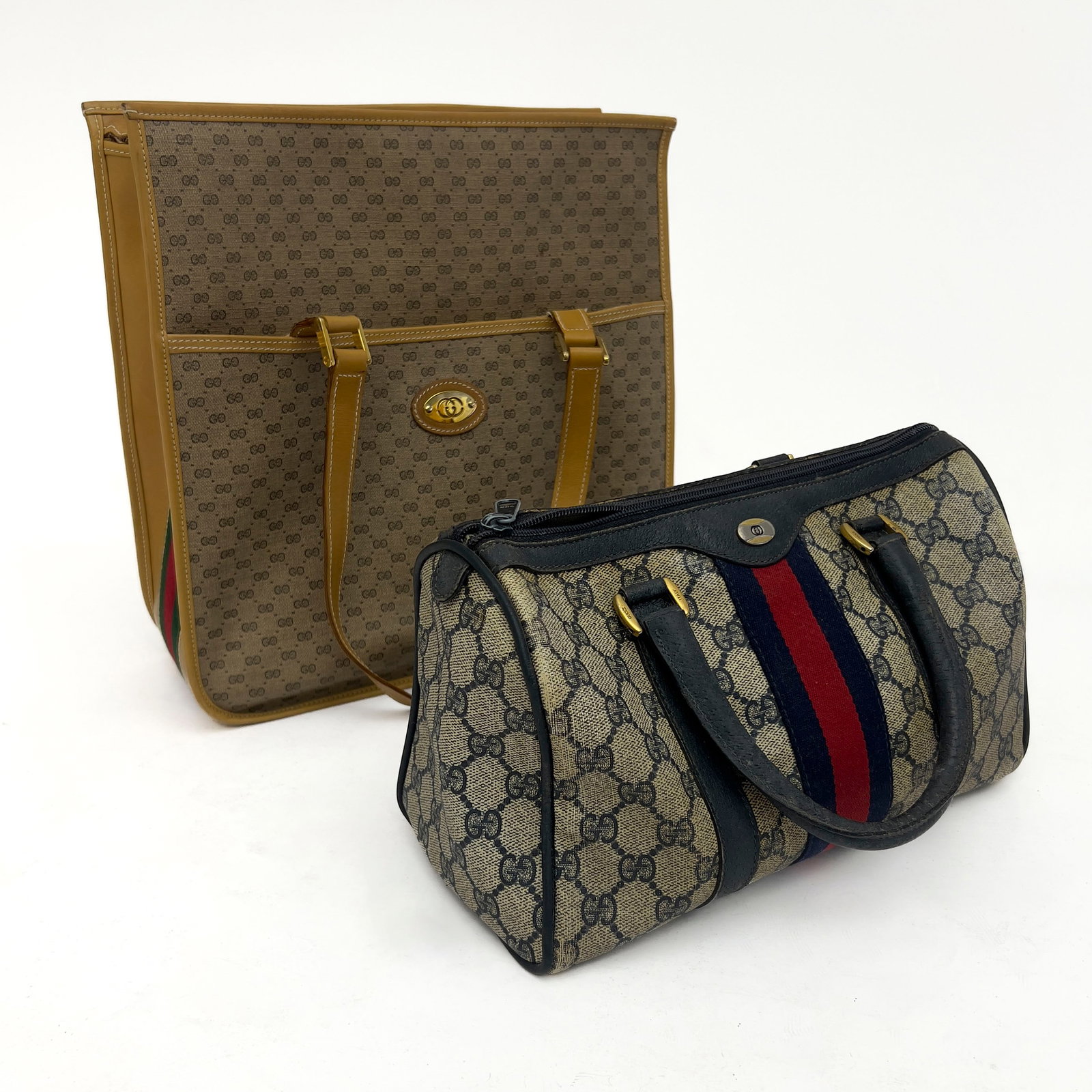 Gucci - A two-piece monogram handbag lot: Lot 175 Gucci Italian Manufacturer (Founded 1921) A two-piece monogram handbag lot (20th Century) Coated canvas, leather, fabric, base metal larger: 12 1/2 x 12/ 1/2 x 5 inches signed Description: