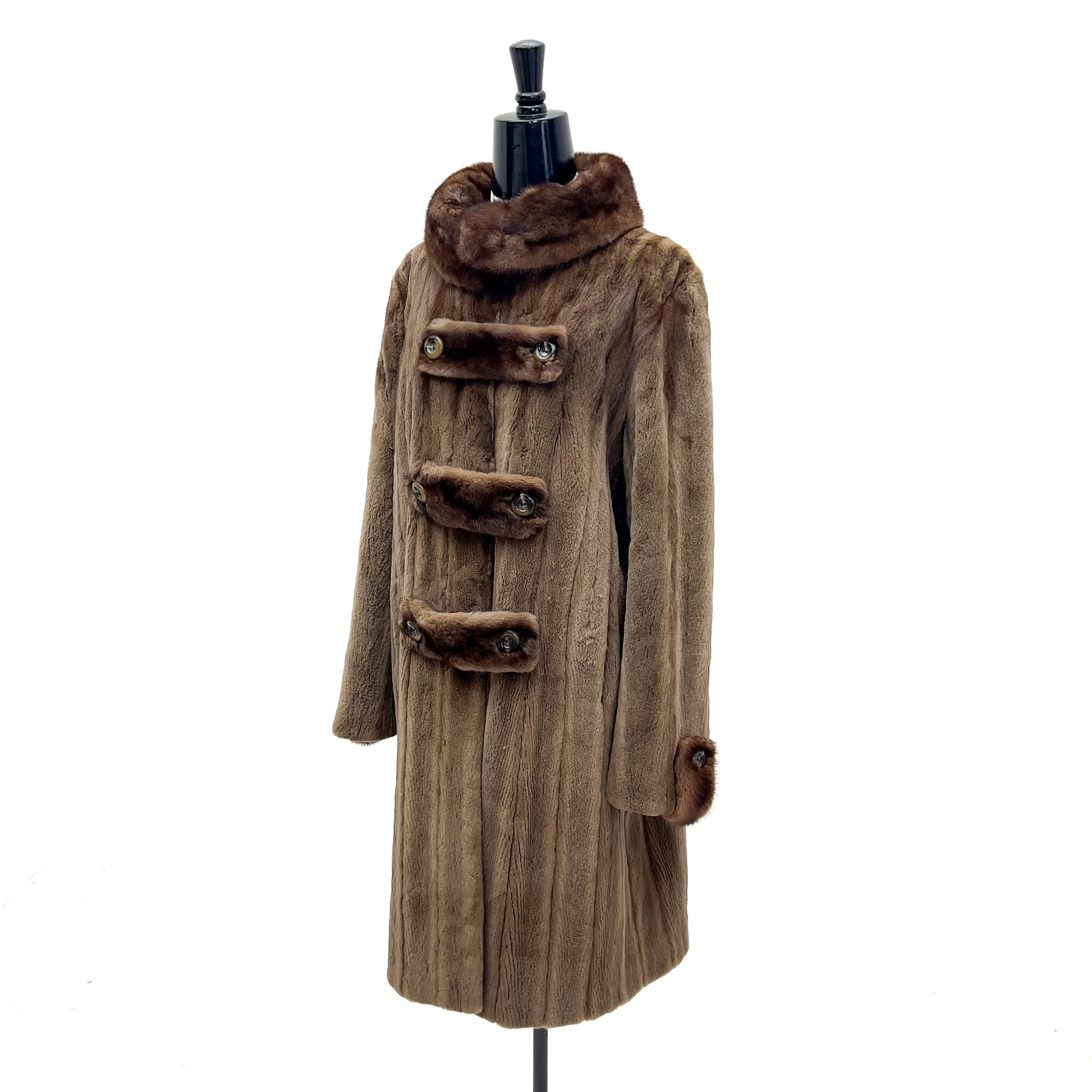 Mohl Fur Co. Let-Out Mink Coat by Bill Blass: Lot 180 Mohl Fur Co. Let-Out Mink Coat by Bill Blass (mid-to-late 20th Century) Mink Fur, Leather, Silk Satin Lining labeled Mohl Description: A Mohl Fur Co. brown let-out mink coat designed by Bill
