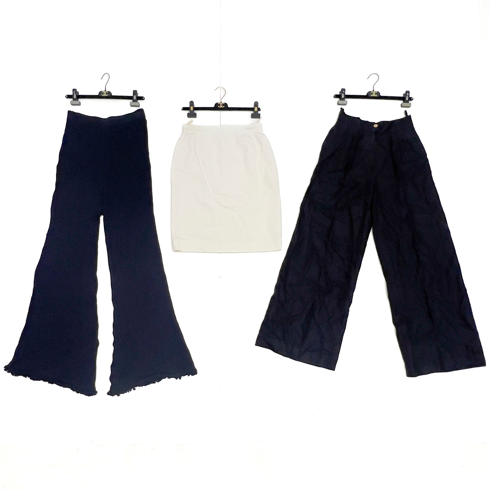 Chanel - A Three-Piece Pants and Skirt Group, Chanel Boutique: Lot 184 Chanel French Manufacturer (Founded 1910) A Three-Piece Pants and Skirt Group, Chanel Boutique (Late 20th Century) Linen, knit fabric labeled Description: A Chanel Boutique three-piece