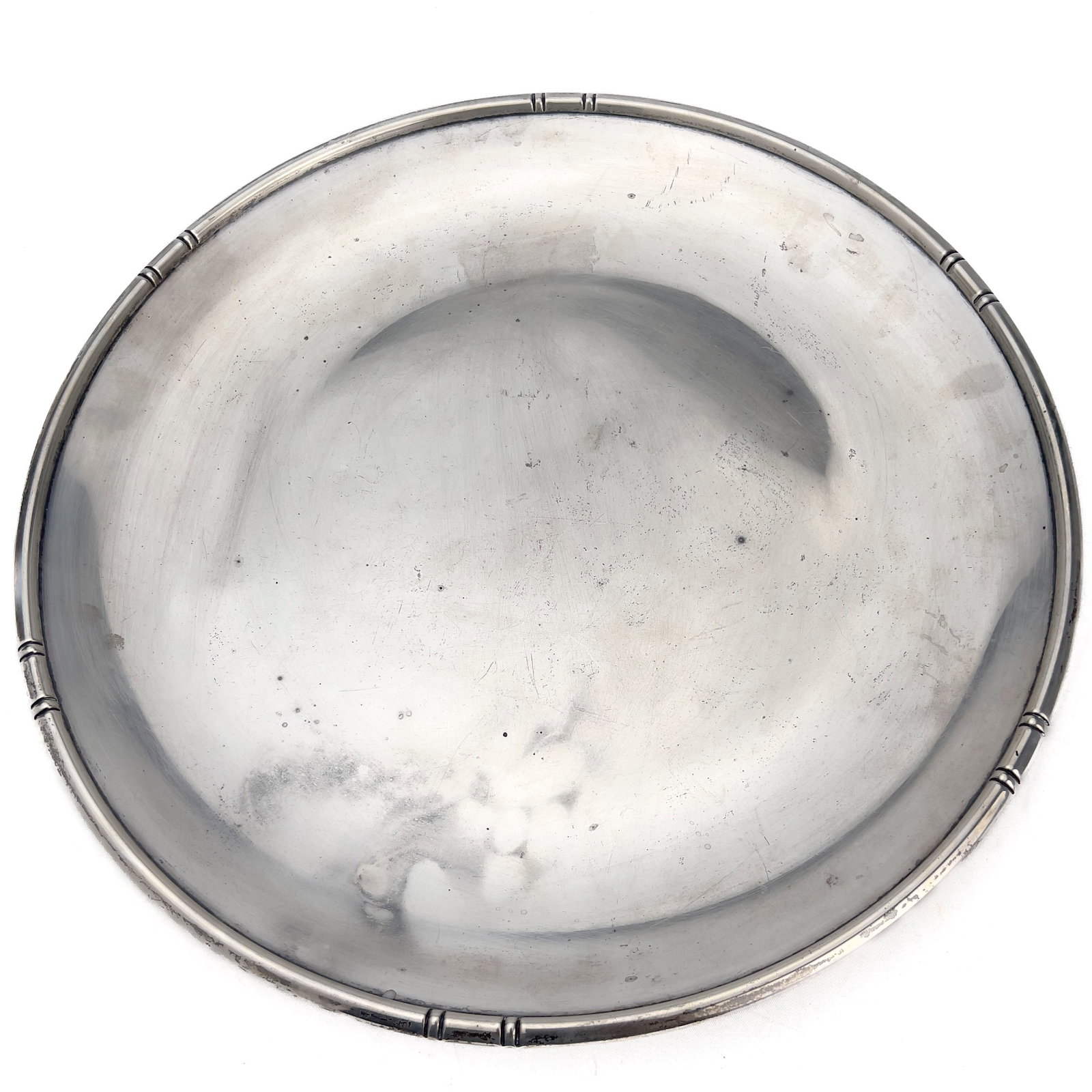 Baldwin & Miller - Sterling Silver Faux Bamboo Edge Salver: Lot 190 Baldwin & Miller American Manufacturer (1883-1983) Sterling Silver Faux Bamboo Edge Salver (Mid-20th Century) sterling silver diameter: 16 3/4 inches stamped B&M Sterling Description: A