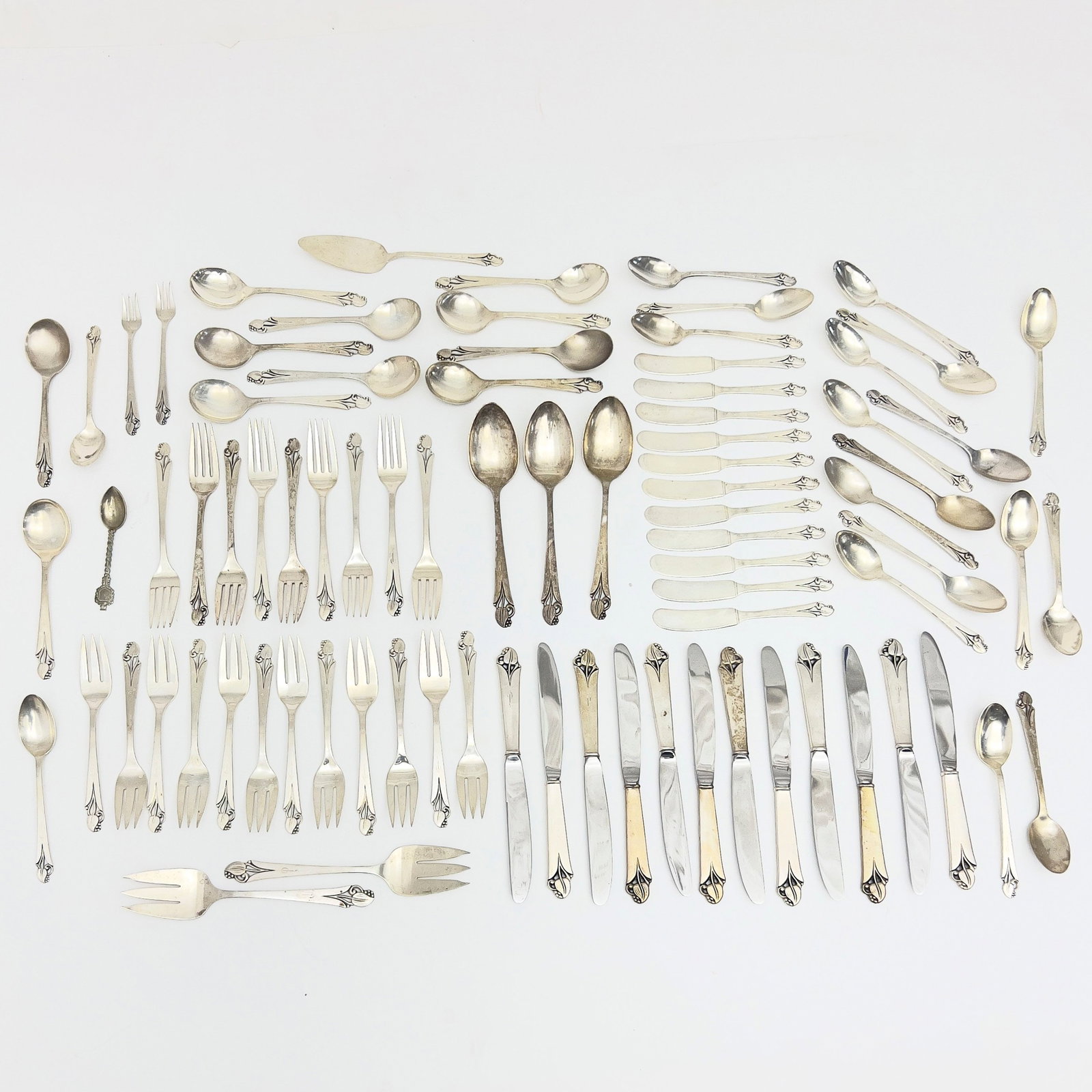 Frank W. Smith - Woodlily Sterling Silver Flatware Service: Lot 200 Frank W. Smith American Manufacturer (1886-1958) Woodlily Sterling Silver Flatware Service (Mid-Twentieth Century) sterling silver stamped Description: A seventy-nine piece sterling silver fl