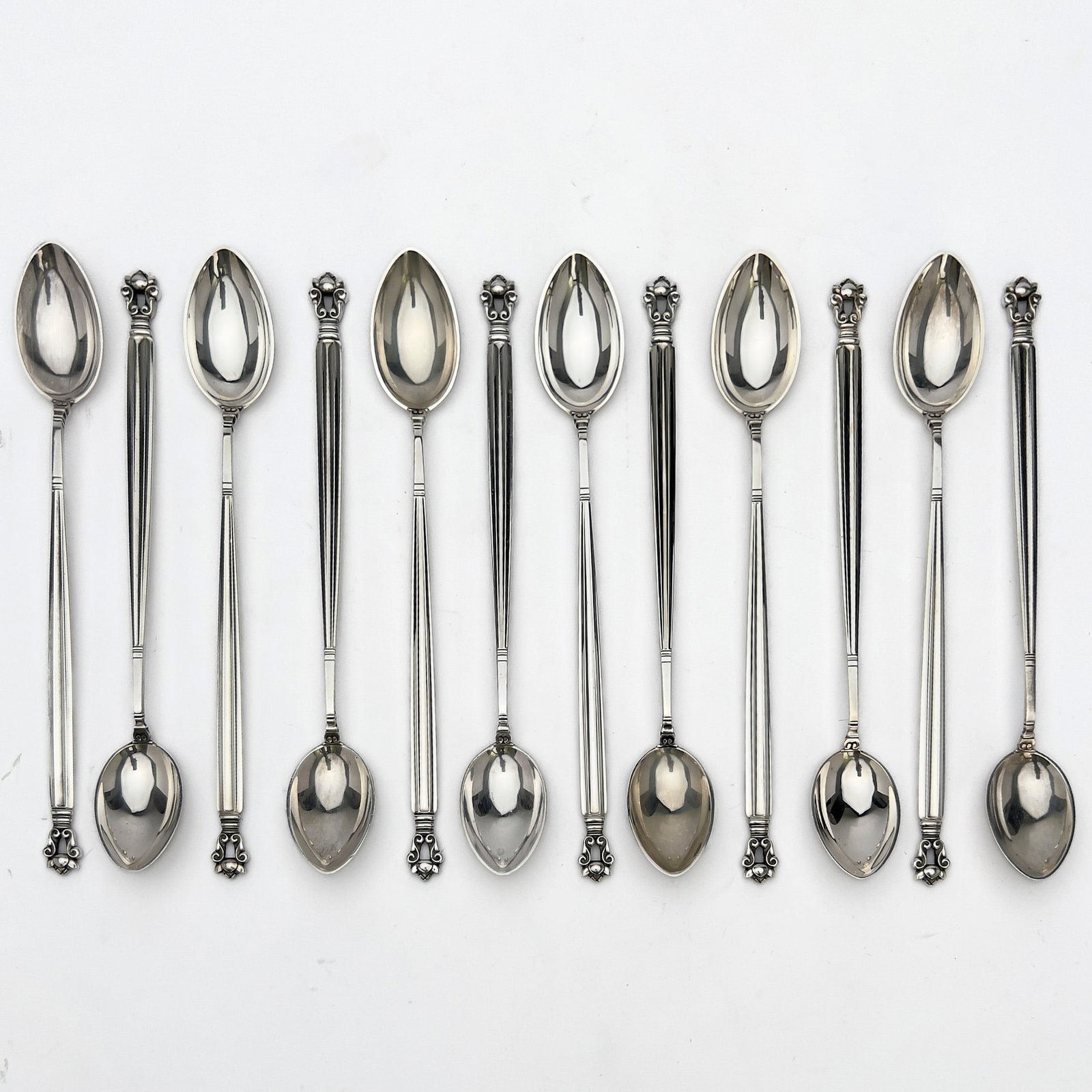 Georg Jensen - 12 iced tea spoons in Acorn pattern: Lot 236 Georg Jensen Danish (1866-1935) 12 iced tea spoons in Acorn pattern sterling 7 1/2 inches witjh Hallmarks Provenance: From a Private New York Collection