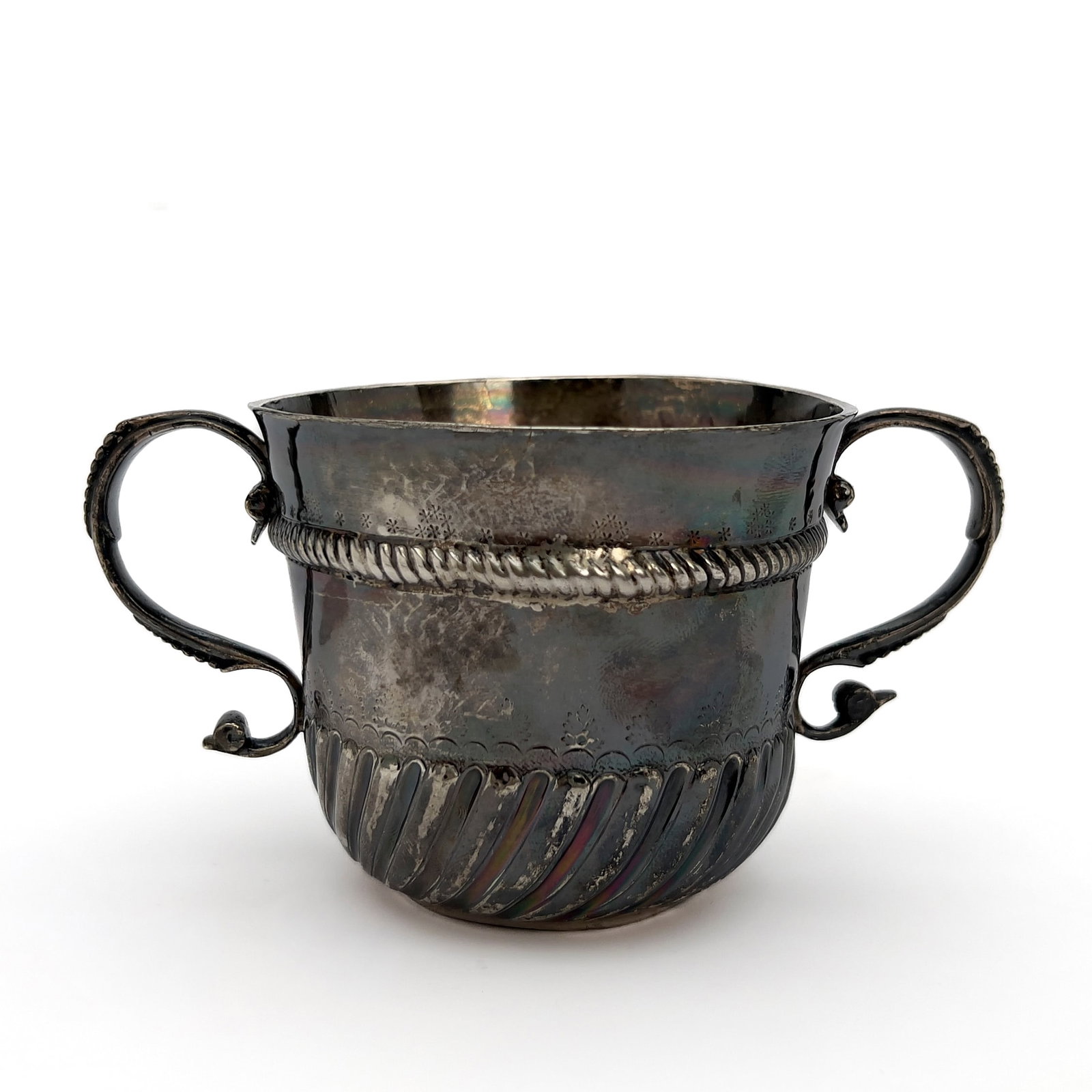 mark of Isaac Dighton - A William III British Britannia Standard Silver Two-Handled Caudle Cup: Lot 239 mark of Isaac Dighton English (1665-1707) A William III British Britannia Standard Silver Two-Handled Caudle Cup (1698) 958 Britannia silver 3 x 6 x 3 3/4 inches hallmarked Description: An