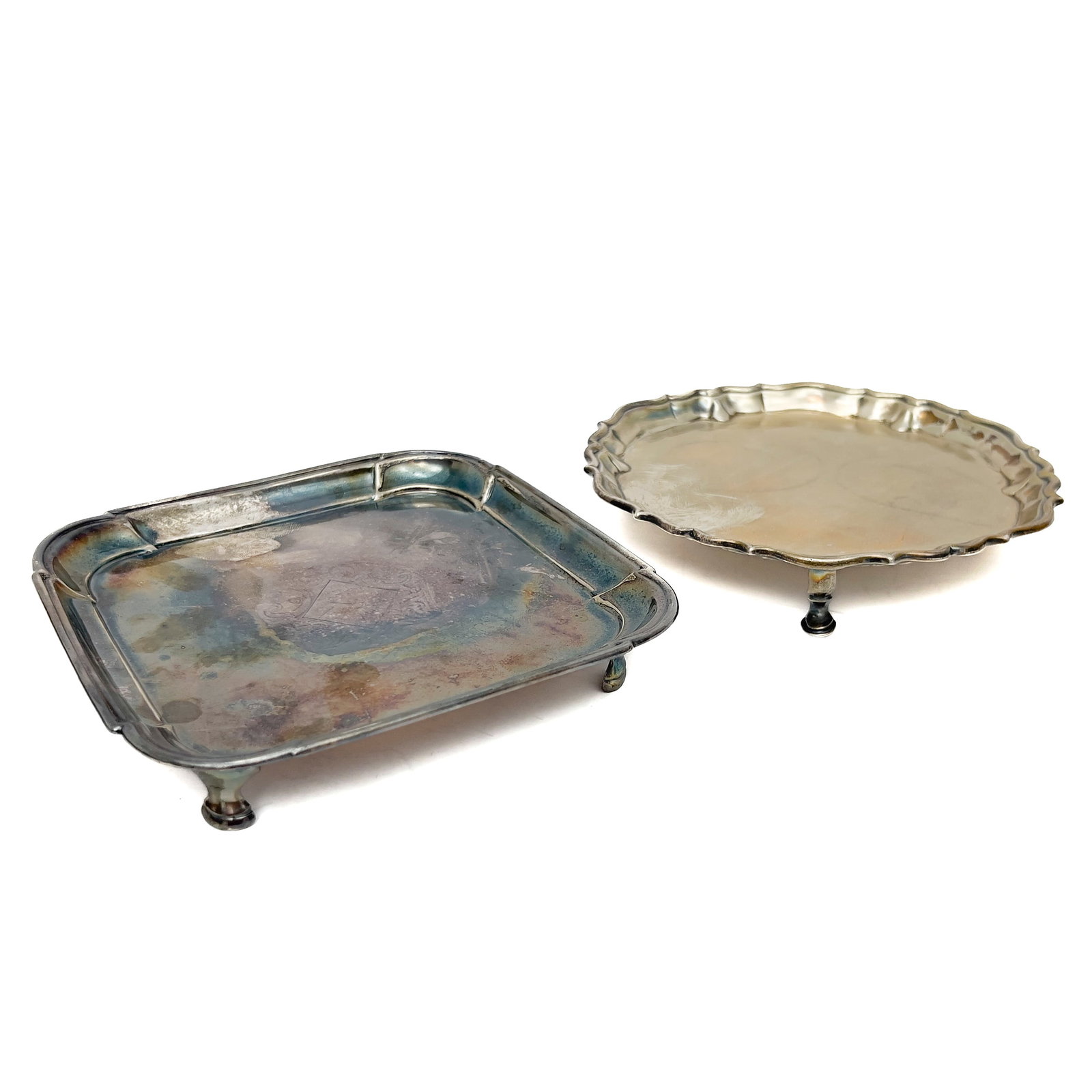 An Assembled Pair of English Sterling Silver Footed Salvers, London, 1725 and 1738: Lot 240 An Assembled Pair of English Sterling Silver Footed Salvers, London, 1725 and 1738 silver round: 6 1/4 x 6 1/4 x 1 inches square: 6 x 6 x 1 inches hallmarks to bottom Description: An