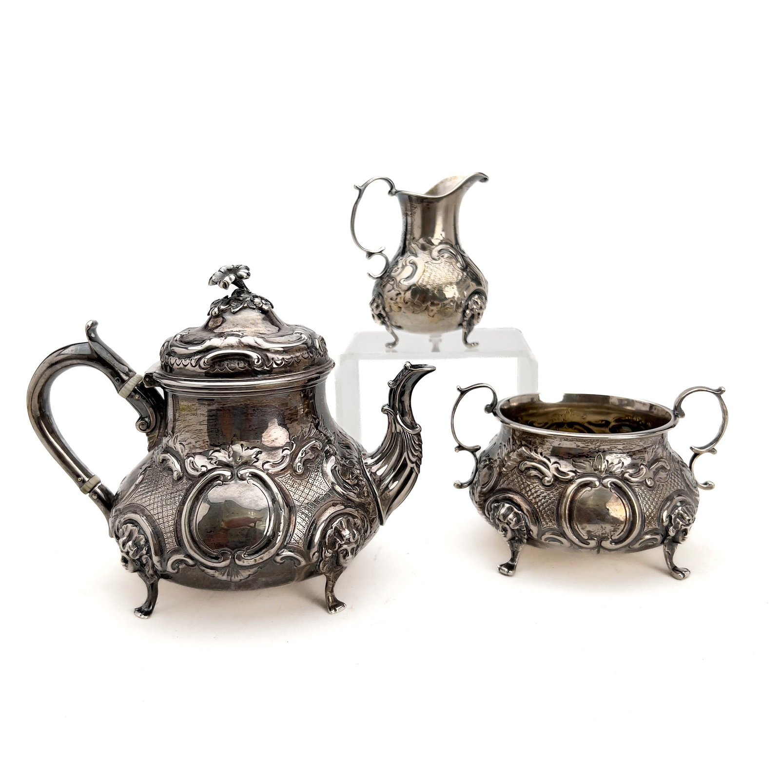 A Victorian British Sterling Silver Repoussé Three-Piece Tea Service (1 of 5)
