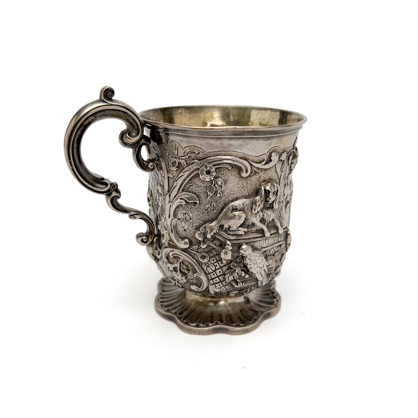mark of James Chalres Edington - Victorian Sterling Silver Repoussé Mug: Lot 249 mark of James Chalres Edington English (active 1828-1969) Victorian Sterling Silver Repoussé Mug (1847) Sterling silver 4 1/2 x 4 1/4 x 3 inches Description: An English Victorian sterli