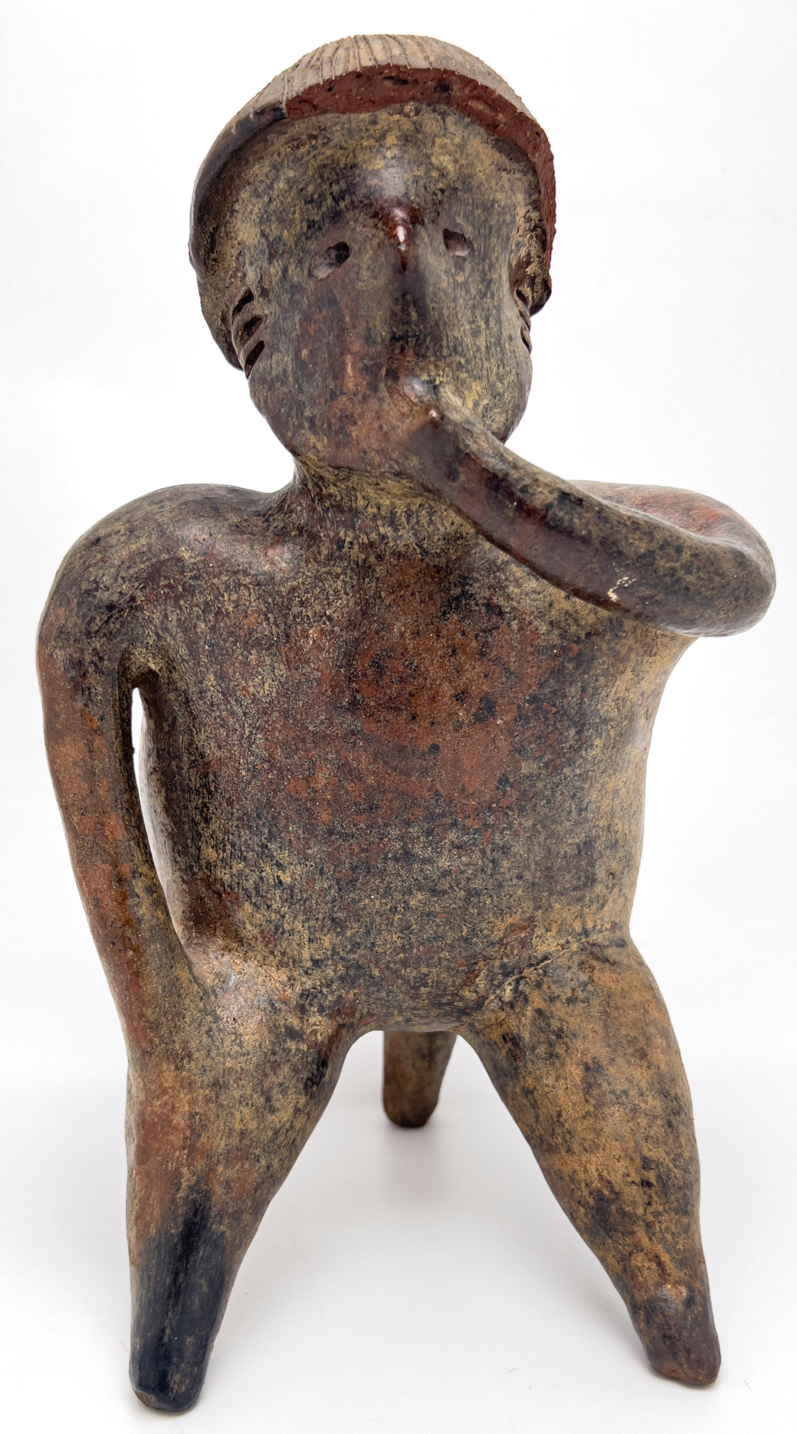 Pre-Columbian West Mexican Hollow Ceramic Figure: Lot 291 Pre-Columbian West Mexican Hollow Ceramic Figure Terracotta clay, Slip glaze, Mineral deposits 12 1/4 x 7 1/2 x 7 inches Description: A Pre-Columbian West Mexican hollow-molded earthenware fig