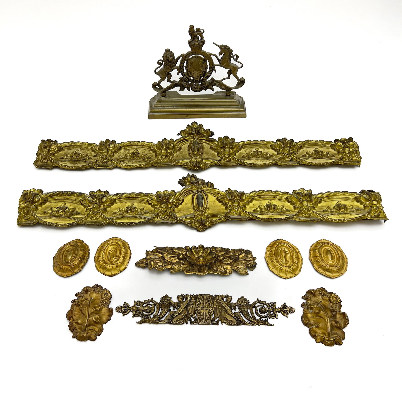 An Assembled Group of Continental Neoclassical Style Brass and Bronze Furniture Mounts and: Lot 294 An Assembled Group of Continental Neoclassical Style Brass and Bronze Furniture Mounts and Architectural Ornaments (19th/20th Century) largest: 7 x 34 1/2 inches Description: An assorted colle