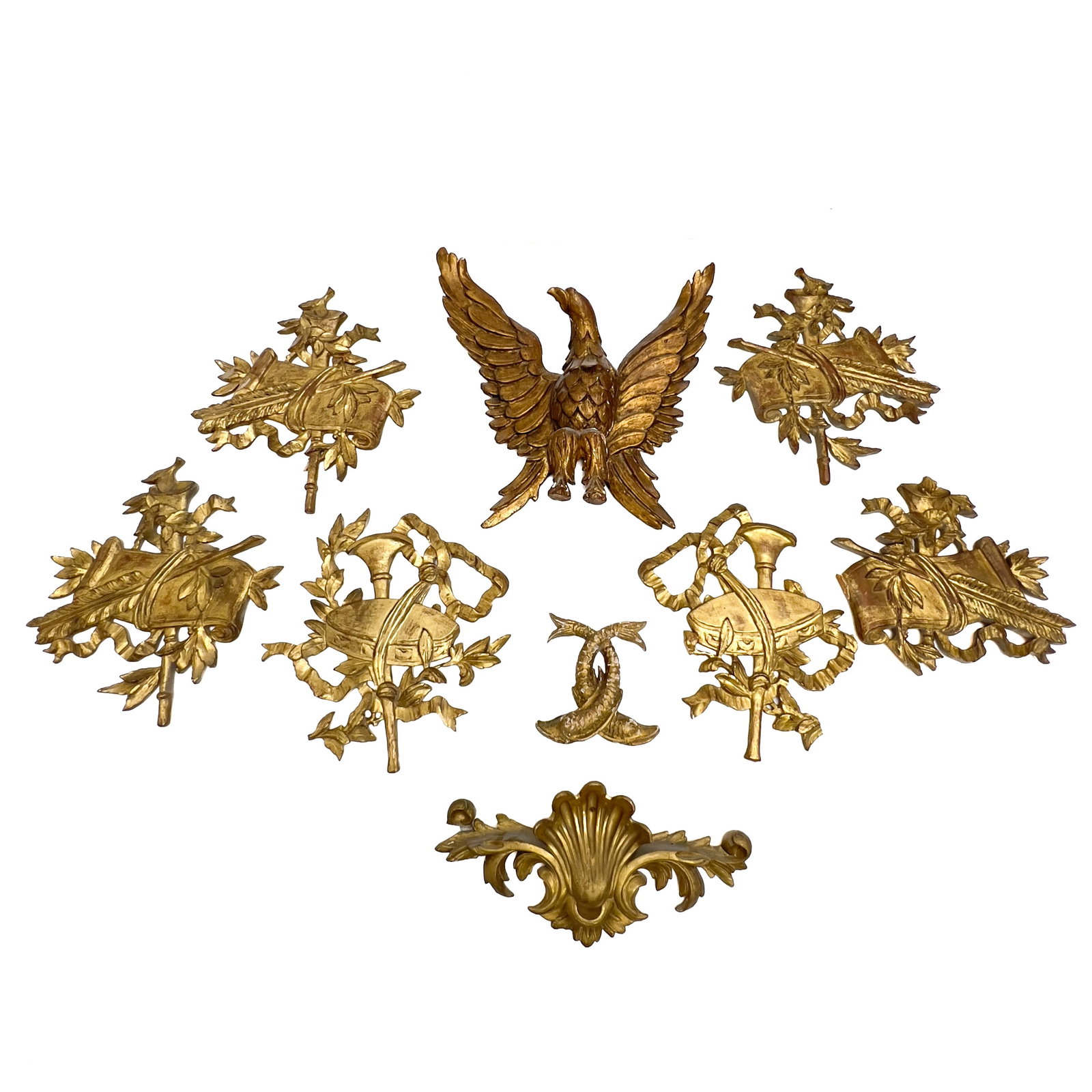 An Assembled Group of Giltwood Wall Decorations, Including an American Federal Style Eagle: Lot 295 An Assembled Group of Giltwood Wall Decorations, Including an American Federal Style Eagle (Mid 20th Century) wood, gold leaf, paint, iron wire bracket eagle: 18 x 18 x 4 1/2 inches Descriptio