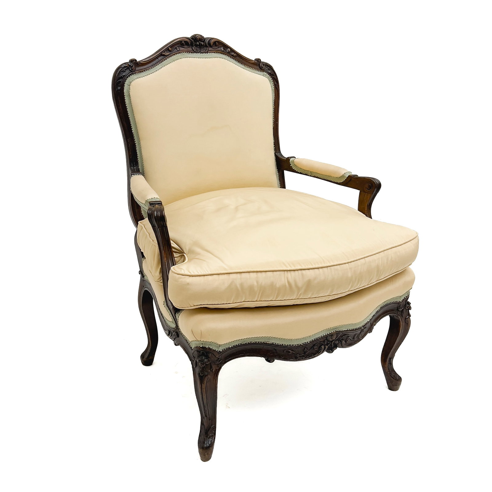 A Louis XV Style Carved Wood Upholstered Bergère: Lot 322 A Louis XV Style Carved Wood Upholstered Bergère Wood, fabric upholstery, foam padding 36 1/2 x 26 1/2 x 24 inches Description: A Louis XV style bergère featuring a carved dark-stain