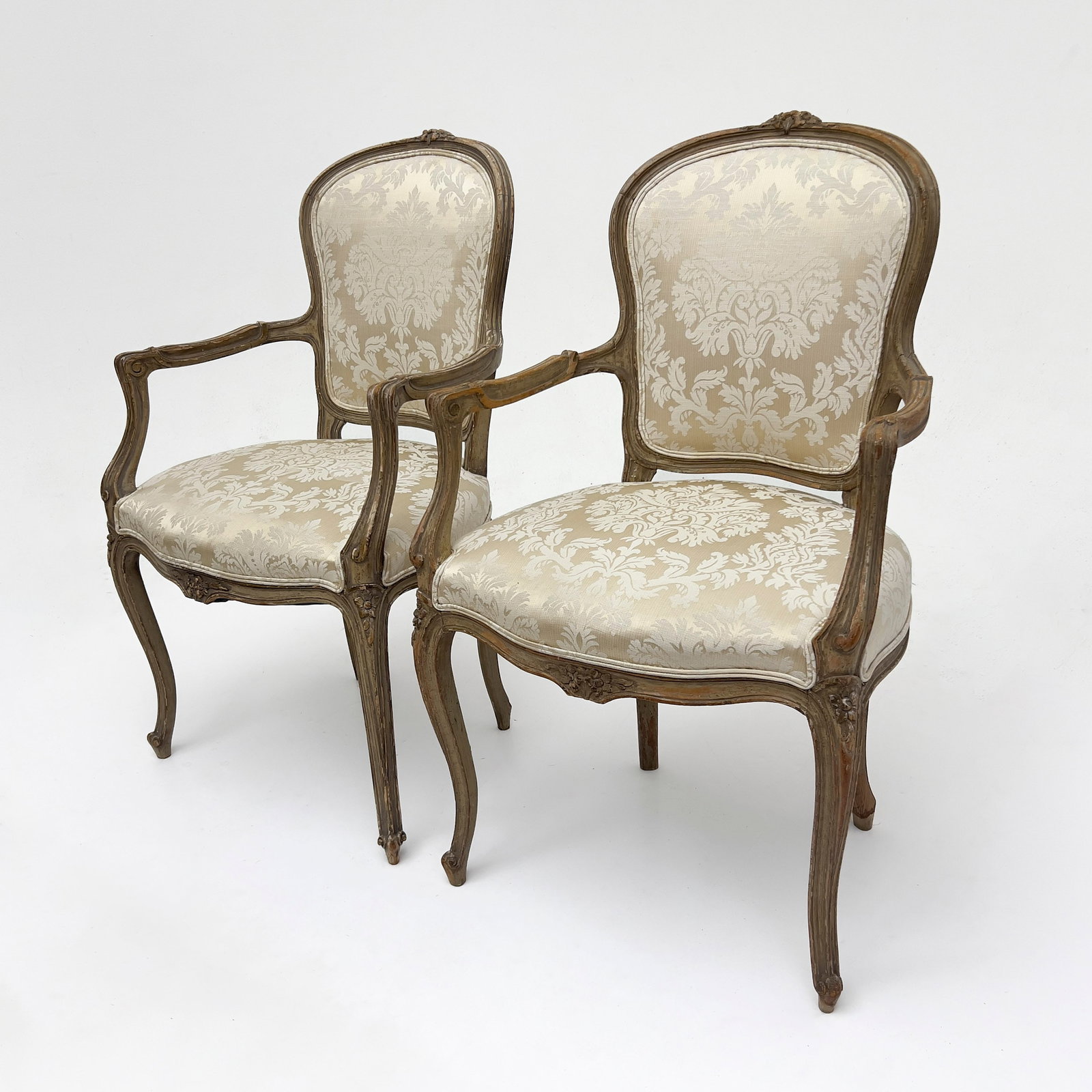 A Pair of Louis XV Style Carved Beechwood Fauteuils: Lot 326 A Pair of Louis XV Style Carved Beechwood Fauteuils (19th/20th Century) Beechwood, textile each: 38 5/8 x 24 3/8 x 20 inches Description: A pair of Louis XV style upholstered armchairs featuri