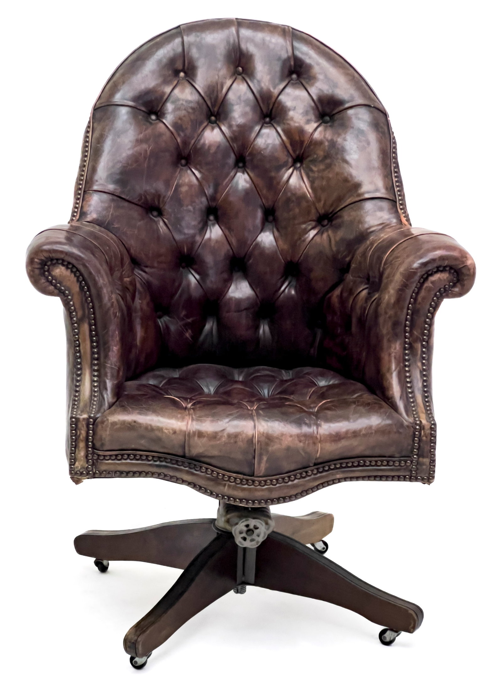 Hillcrest Chesterfield Executive Swivel Chair: Lot 329 Hillcrest Chesterfield Executive Swivel Chair Leather, Wood, Brass metal, Iron spring mechanism, Base metal casters 43 1/2 x 31 x 31 inches seat height: 18 1/2 inches with manufacturer label D