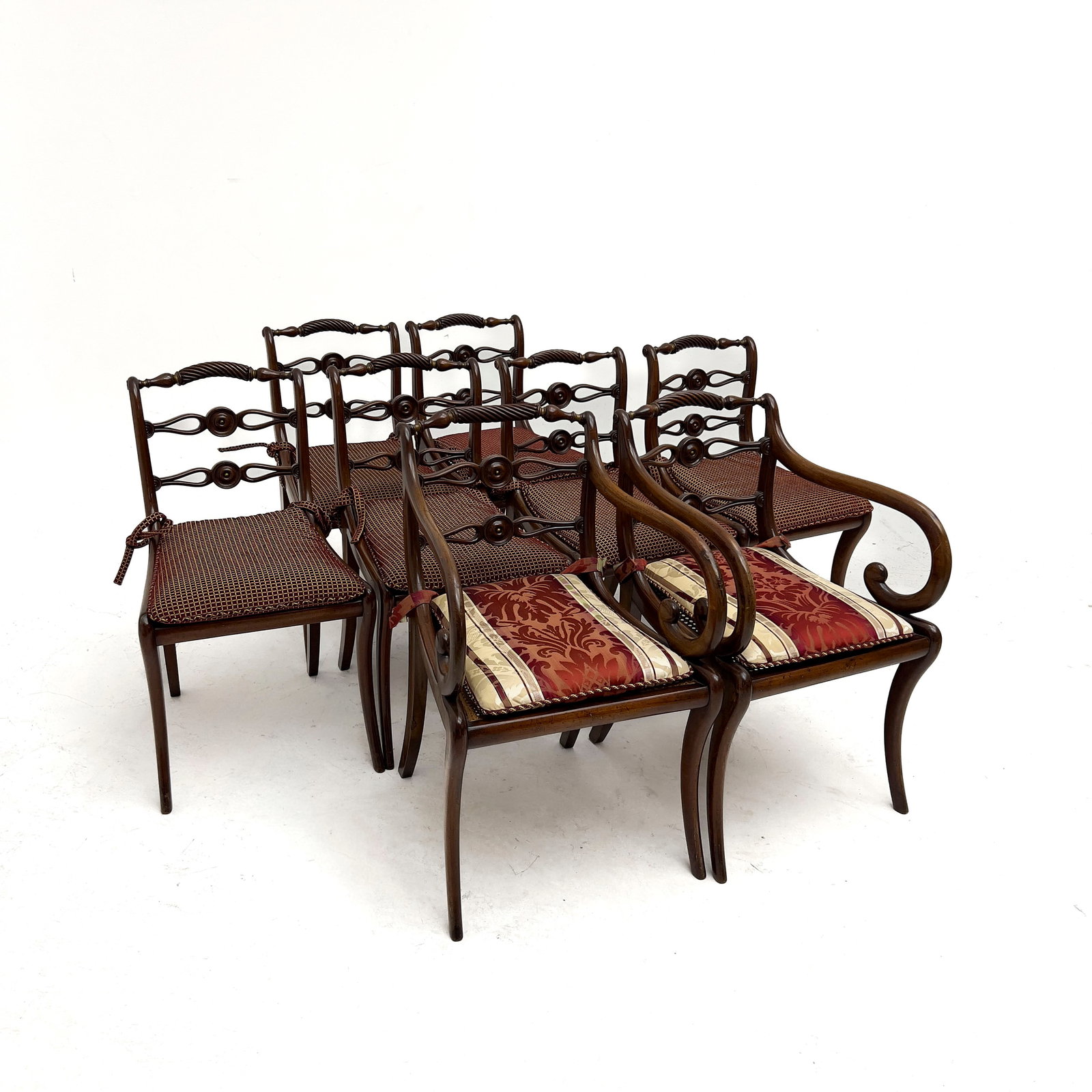 Suite of Eight Regency Style Carved Hardwood Dining Chairs: Lot 345 Suite of Eight Regency Style Carved Hardwood Dining Chairs ( 20th Century) Hardwood, woven rattan cane, upholstery textile Arm chair : 32 x 22 x 20 inches Description: A suite of eight dining 