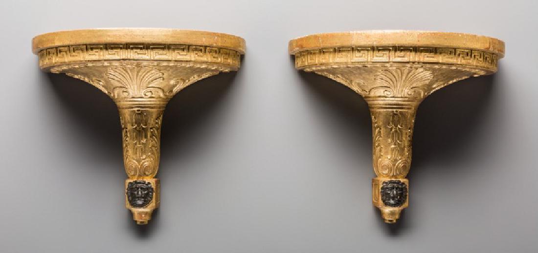 PAIR OF GILTWOOD AND PAINTED FAUX MARBLE BRACKETS: A pair of giltwood and painted faux marble brackets Measurements: 11.38" H x 13.13" W x 7" D (28.9 x 33.3 x 17.8 cm)