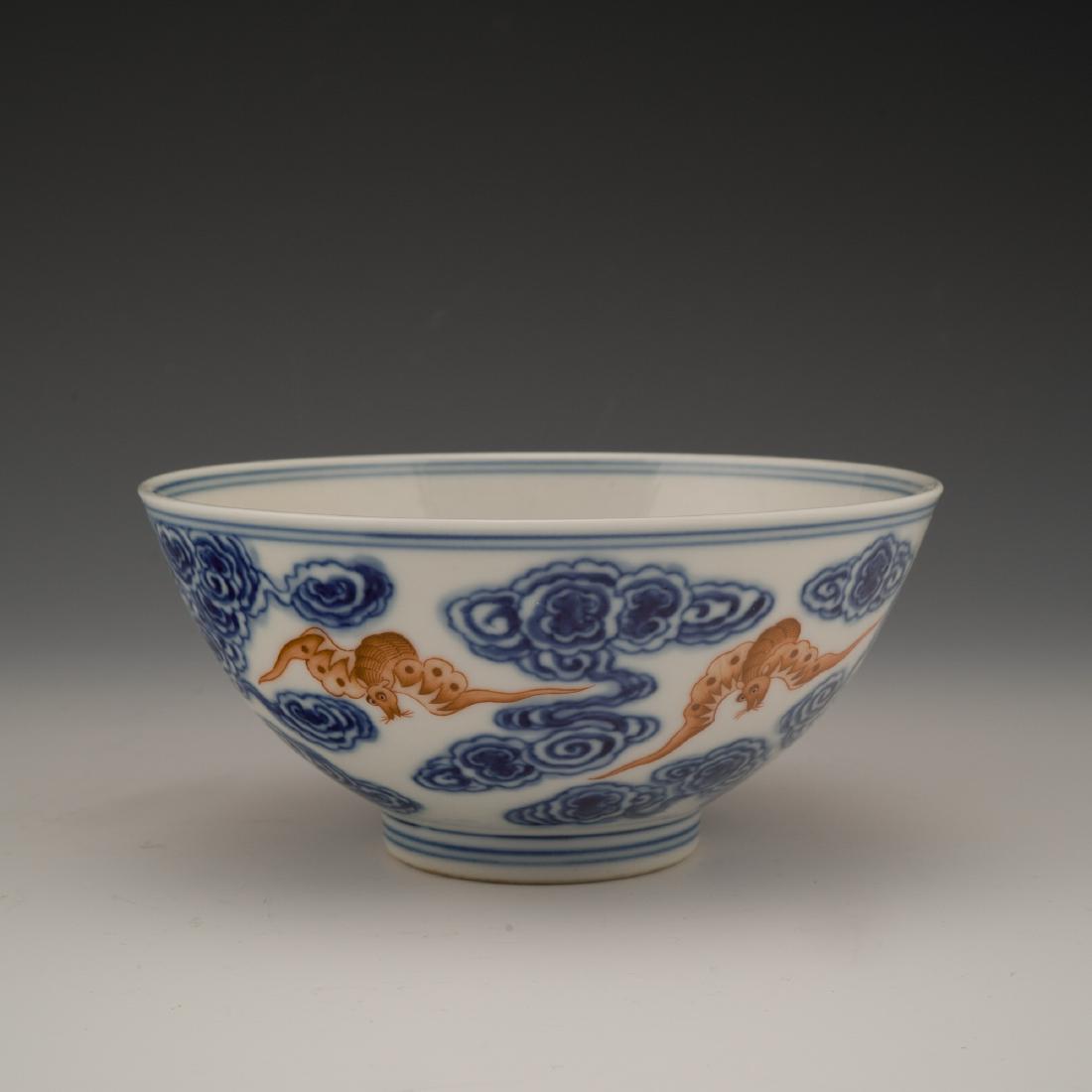 GUANGXU BLUE & RED FU BATS PORCELAIN BOWL: 19th/20th Century Chinese Qing Dynasty porcelain bowl, is finely potted in round cavetto gracefully elevating upward steep sides leading to flat rim, raised upon a concaved foot base. The exterior del