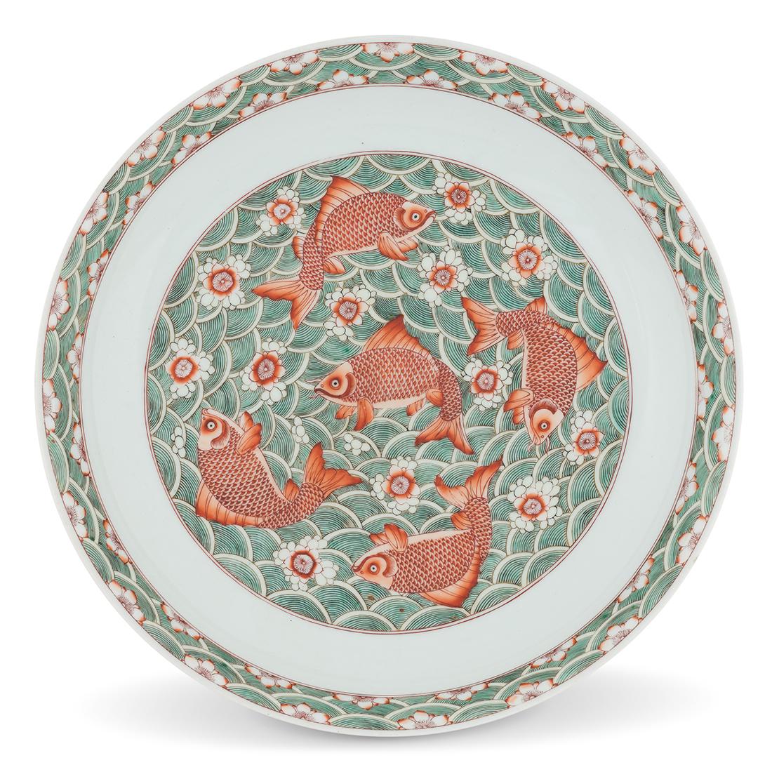 KANGXI FIVE CARPS PORCELAIN PLATE: Chinese Qing porcelain plate, finely potted in a shallow shaped vessel, broad wide cavetto elevated the rounded sides, raised upon a concaved foot base. The central interior decorated with hand painti