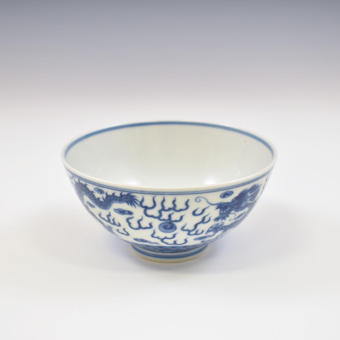 BLUE & WHITE DRAGON PORCELAIN BOWL: Chinese porcelain potted shape of a simply bowl deep vessels, the rounded cavetto gently rising the sides toward the flat rim, raised upon a concaved foot base with a slightly raised footing. The exte