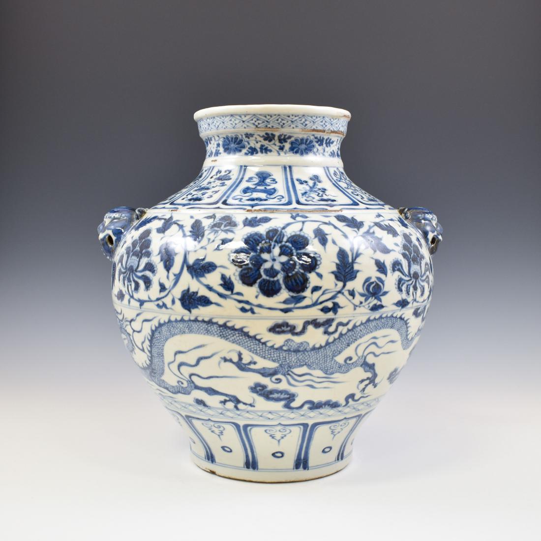 YUAN DYNASTY BLUE & WHITE WRAPPED FLORAL JAR: Magnificent, Chinese Yuan / Early Ming Dynasty porcelain. Sturdily potted in a baluster jar, has a tall feminine silhouette with broad shoulders and a body that either tapers to the foot or pinches at