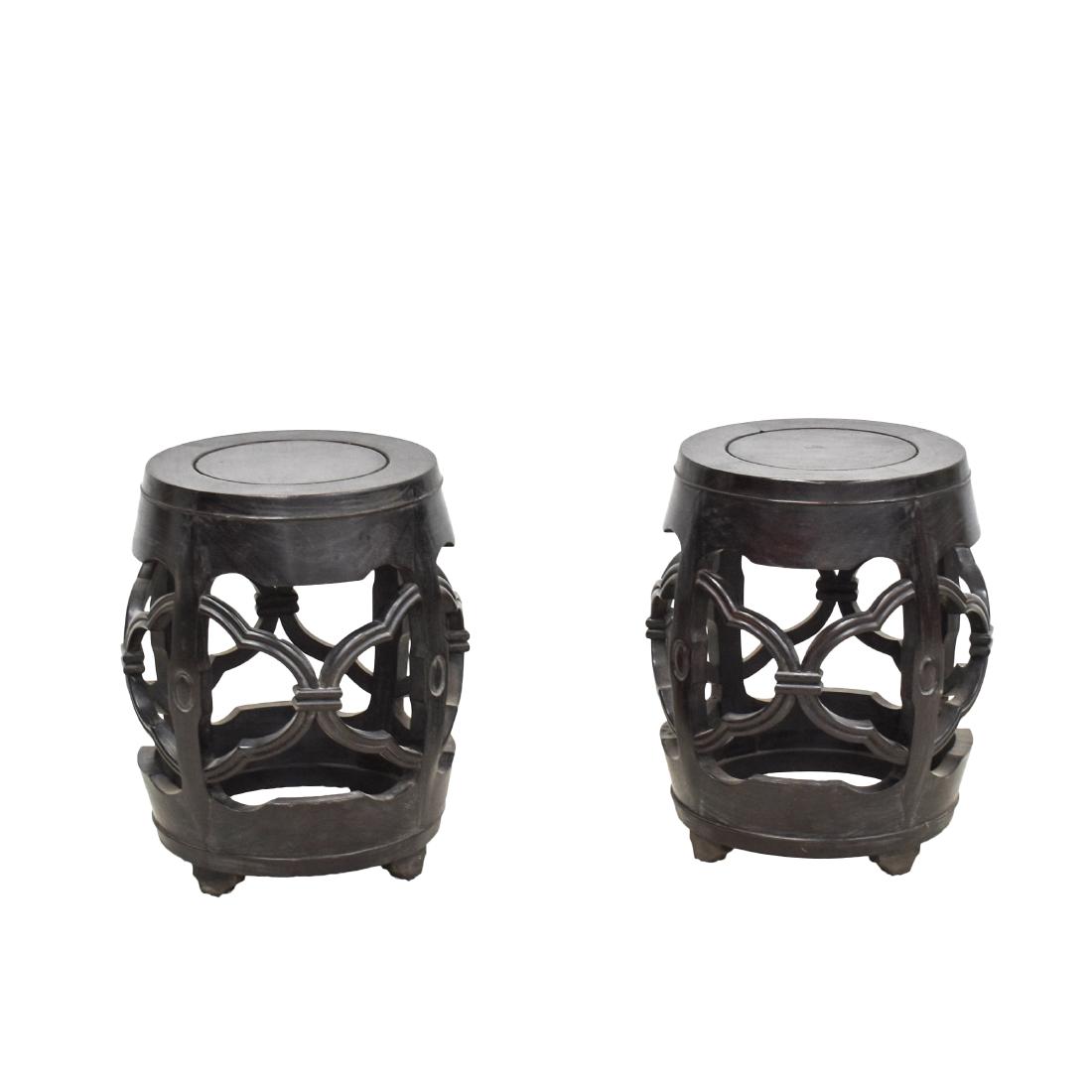 19TH C PAIR OF ZITAN BAREL SHAPE OPEN-WORK STOOLS: Pair of 19th Century Chinese Zitan wood barrel shaped stools, carved in cylindrical form, swelled on the belly, with flat round top, raised on four ruyi shaped squat legs. The flat round top terminati