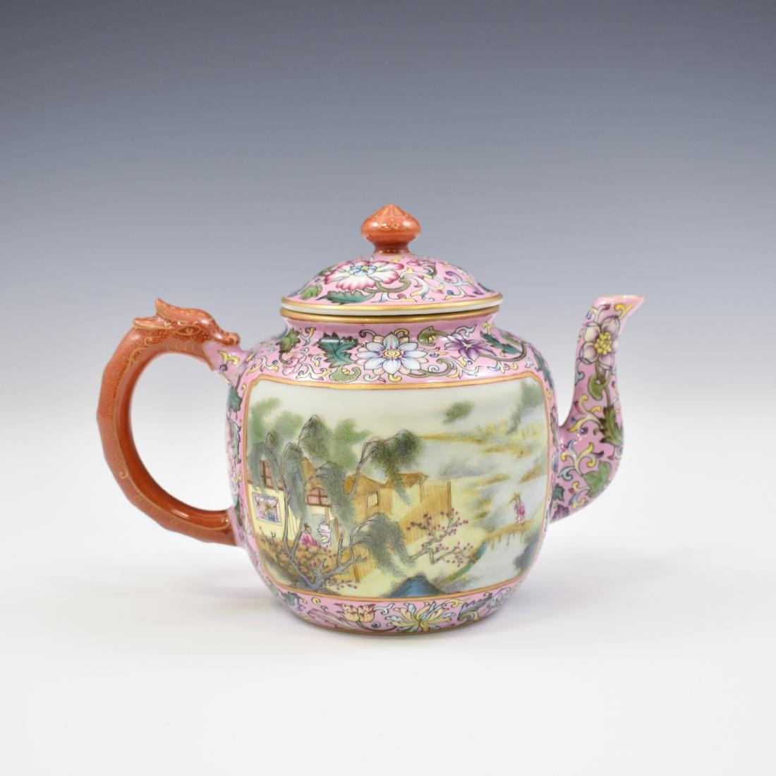 QIANLONG FAMILLE ROSE & GILT TEA POT: Qianlong Chinese porcelain tea pot is potted in globular body, raised upon a flat base, with dome lid by ruby-red bud finial. Flanked with ruby-red archaic dragon curved spout and a simply looped hand