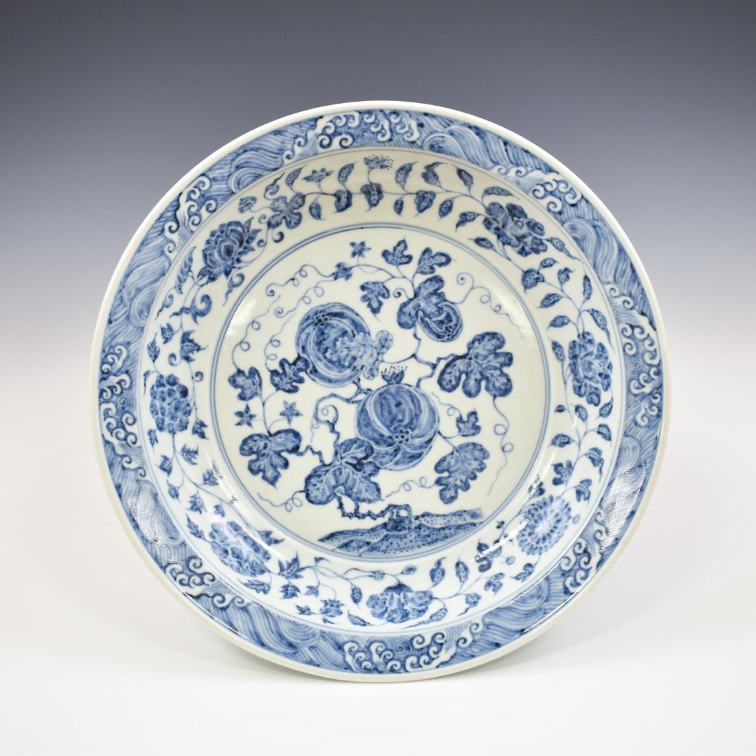 YONGLE BLUE & WHITE FRUIT ABUNDANT PLATE: Rare, Yongle hand painting in a blue and white color porcelain plate. Finely potted in a globular shaped vessel, broad wide cavetto elevated the rounded sides, raised upon a wide concaved foot base. F