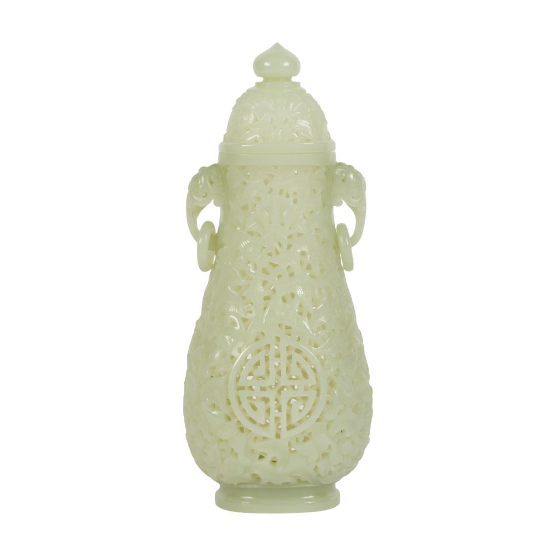 CHINESE JADE LIDDED VASE: Stunning nephrite celadon jade vase. Finest carved celadon jade covered vase, tall gourd shaped body elevated on round cavetto, flanked ears, emerging two open work elephant shaped ears suspending the