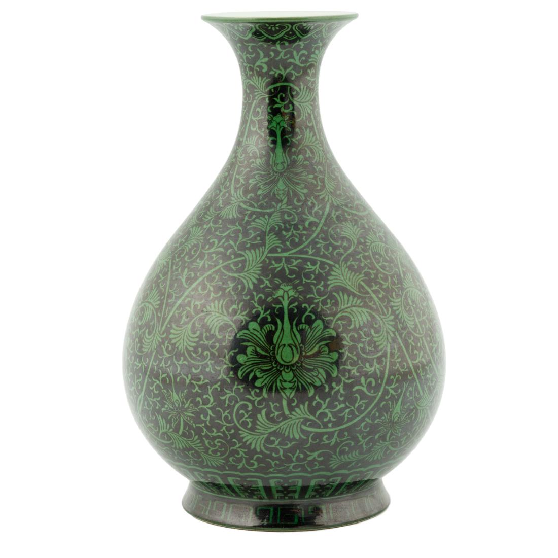 QIANLONG FAMILLE NOIR PEAR SHAPED VASE: Chinese Qing Dynasty famille noir wrapped floral pear shaped vase. Ovoid shaped body gracefully tapered toward waisted neck and flaring rim, Raised upon a splayed concave foot base. The exterior decor