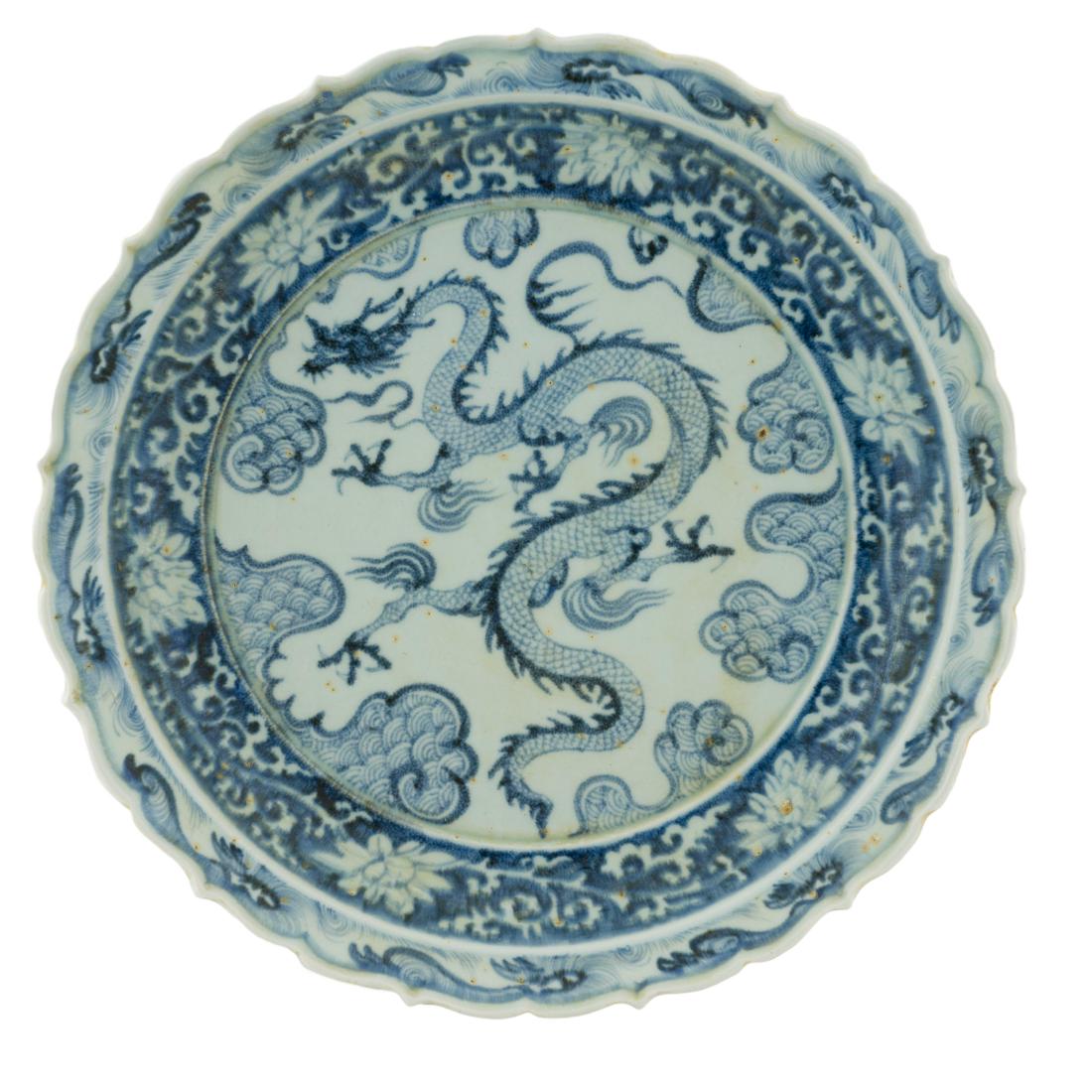 YUAN BLUE & WHITE DRAGON PLATE: Chinese 12th Yuan Dynasty early Ming reign, Extraordinary Blue and White dragon plate. Finely potted in shallow vessel form, with broad wide central interior, rounded cavetto gently tapering to open w