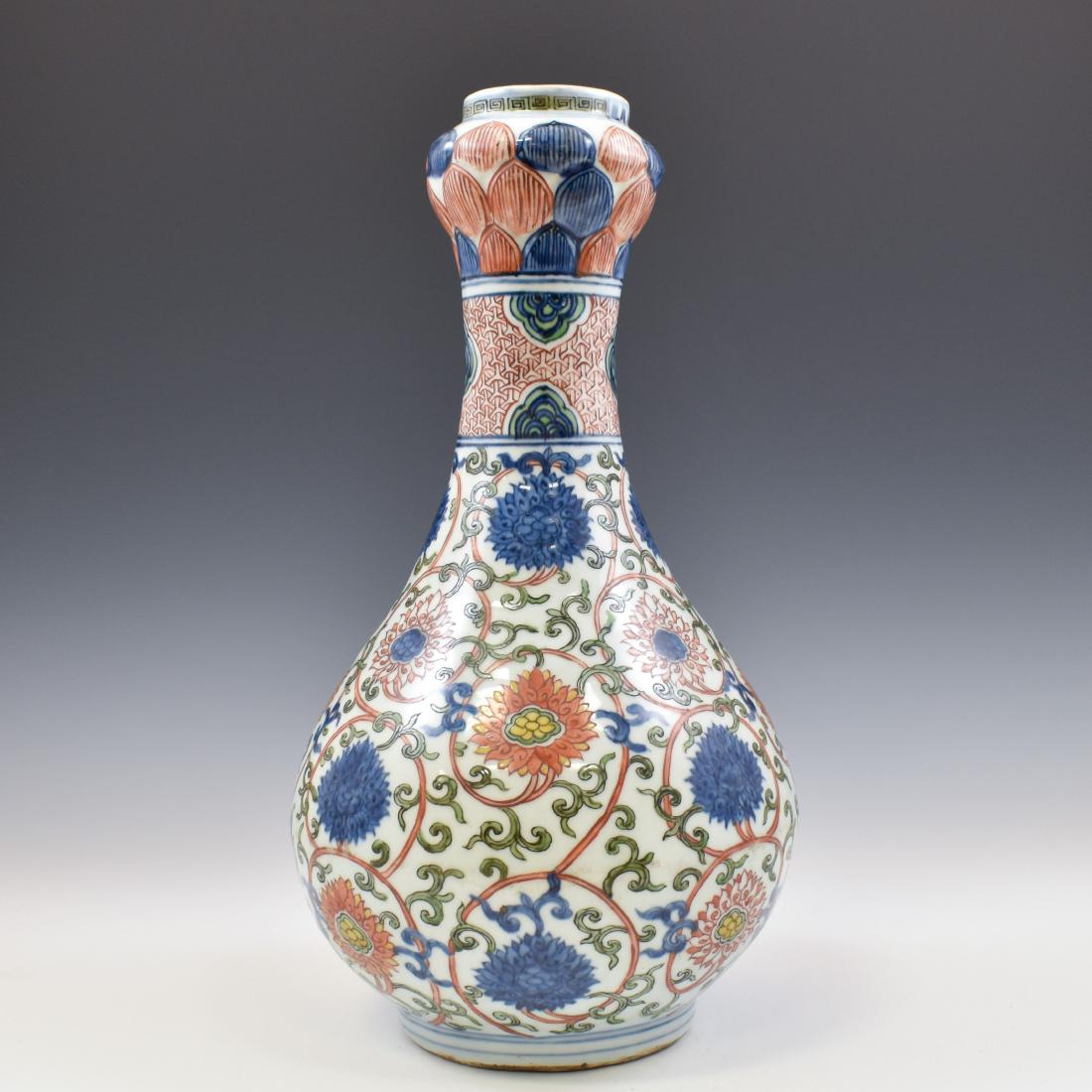 MING WUCAI CHRYSHANTEMUMN GARLIC VASE: Chinese Ming Dynasty Wucai glazed porcelain garlic vase. Tall ovoid body, with bulbous lower region sweeping up into a slender neckline and onion-shaped head, supported on short foot ring with double 