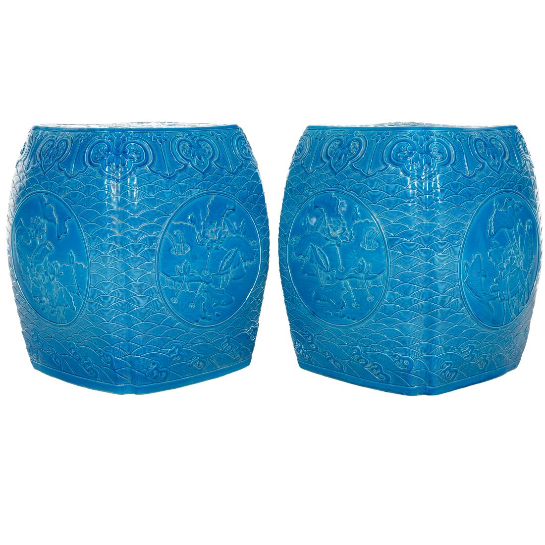 PAIR QING TURQUOISE GREEN GLAZED PORCELAIN STOOLS: Pair of Chinese Qing Dynasty porcelain stool, shaped in semi squared barrel with grooved corners. The exterior carved with auspicious pattern and arrays of ruyi bands. All covered in attractive turquo