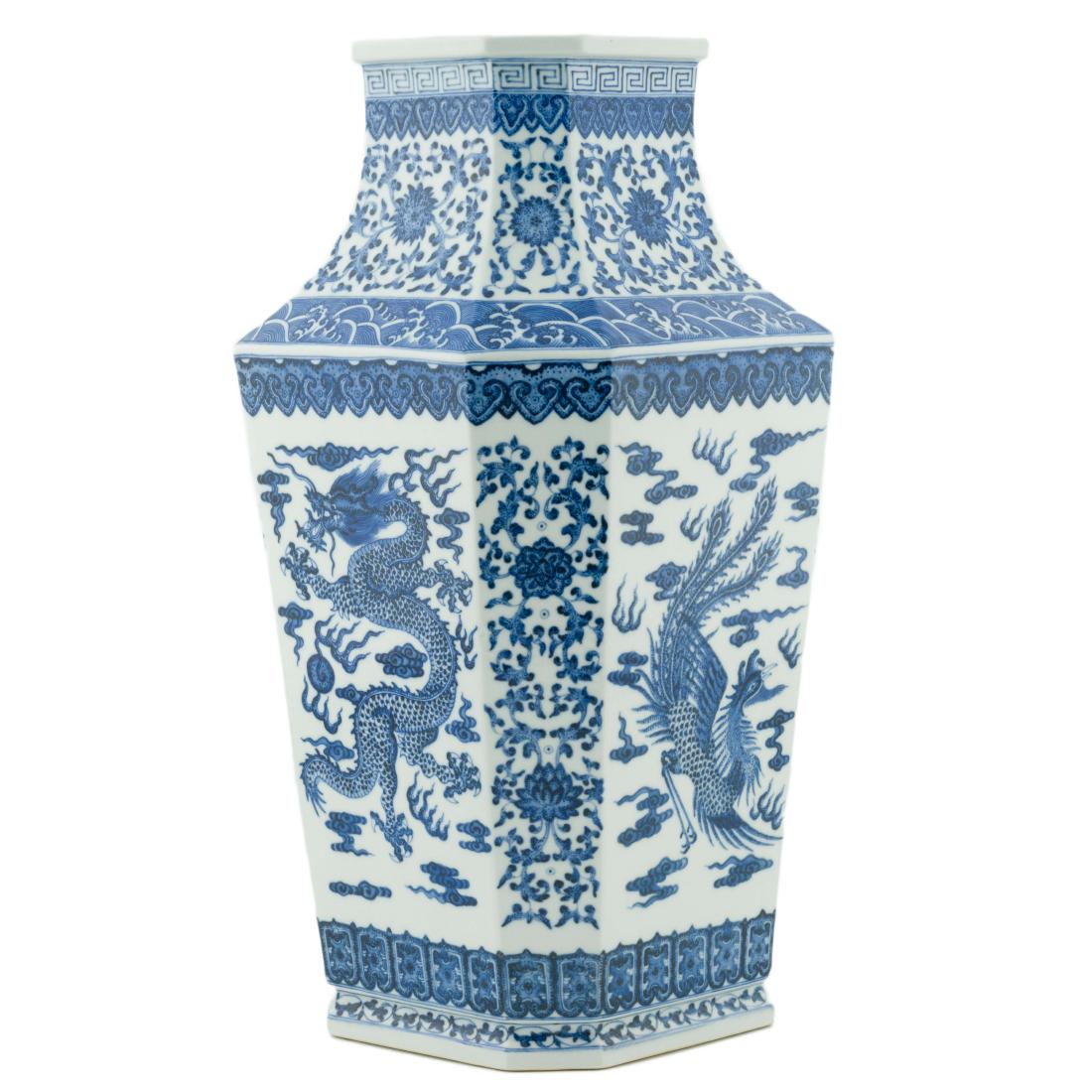 BLUE & WHITE DRAGON PHOENIX SQUARE VASE: Having squared baluster shape body, with angled corners, waisted neck emerged from angled shoulder further to square opening. The each panel of the main body decorated with cobalt blue underglaze hand