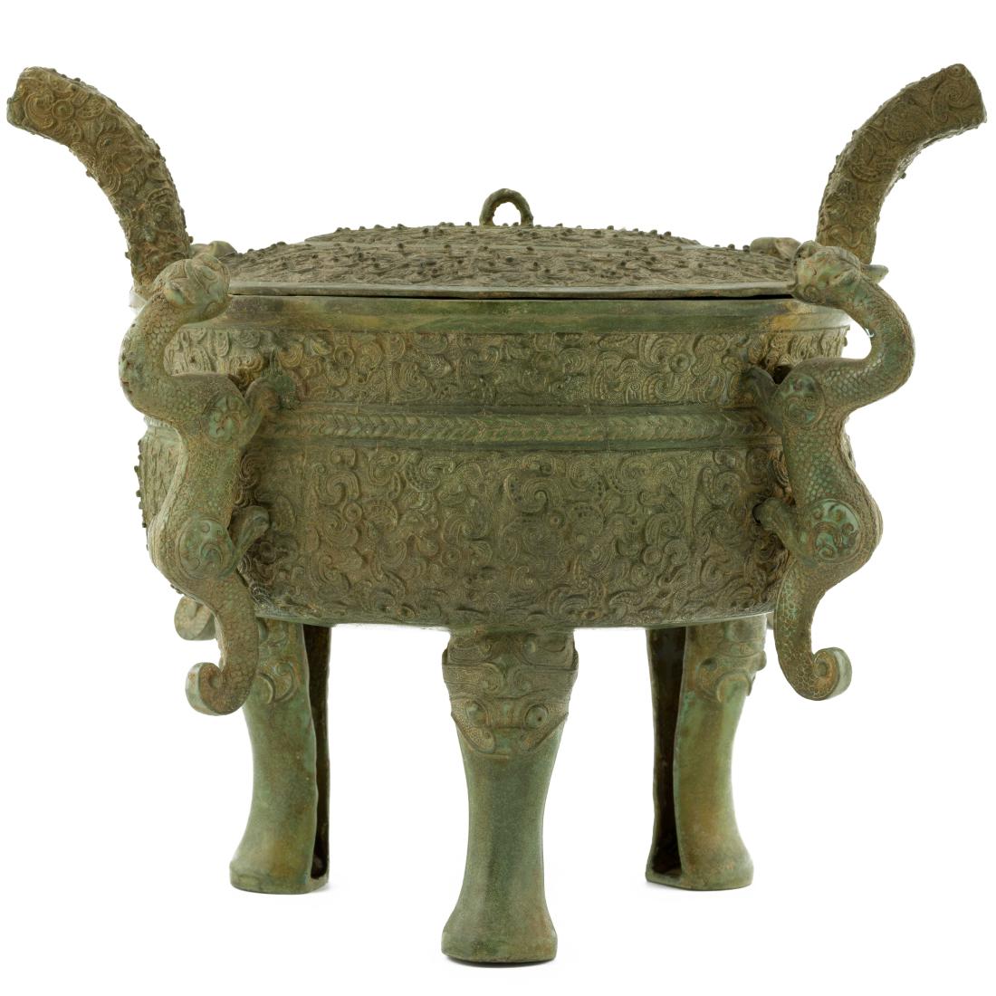 SHANG DYNASTY BRONZE LIDDED CENSER: VERY RARE, Chinese Shang dynasty bronze lidded censer. With a cupped body, circular opening, raised on three shallow cabriole legs emerged from Taotie masks. Two huge crescent handles emerged from the