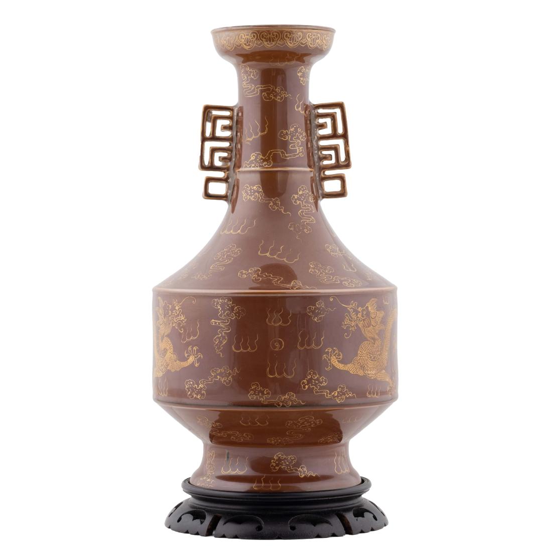QIANLONG ZIJIN GLAZED AMPHORA VASE ON STAND: Chinese Qing Dynasty amphora Zijin glazed porcelain vase. Amphora vase potted in a globular lower body, tapered gracefully toward straight tall neck leading to a slightly incurved rim, flanked with tw
