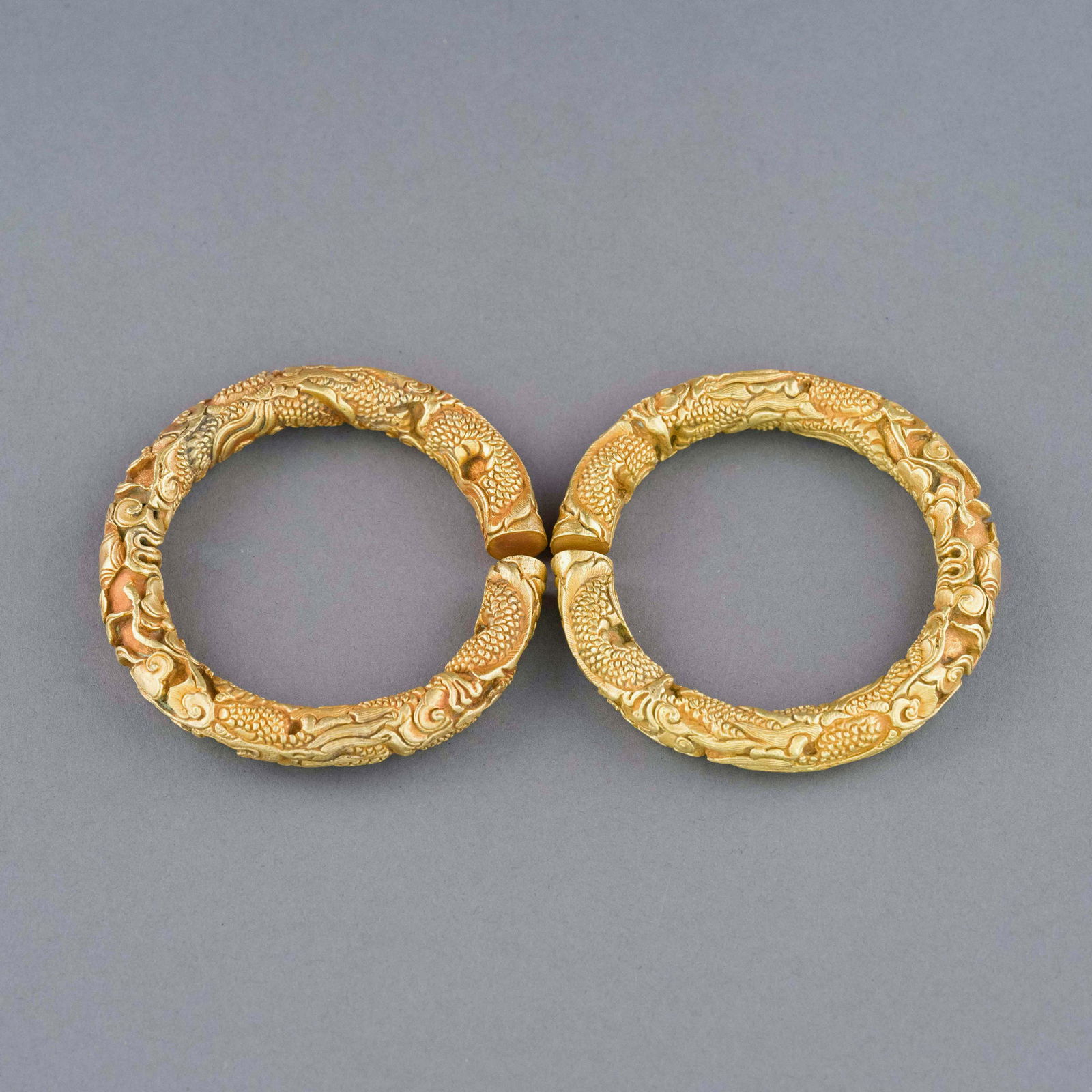 PAIR QING GILT BRONZE SCALED DRAGON MOTIF BANGLES (1 of 5)