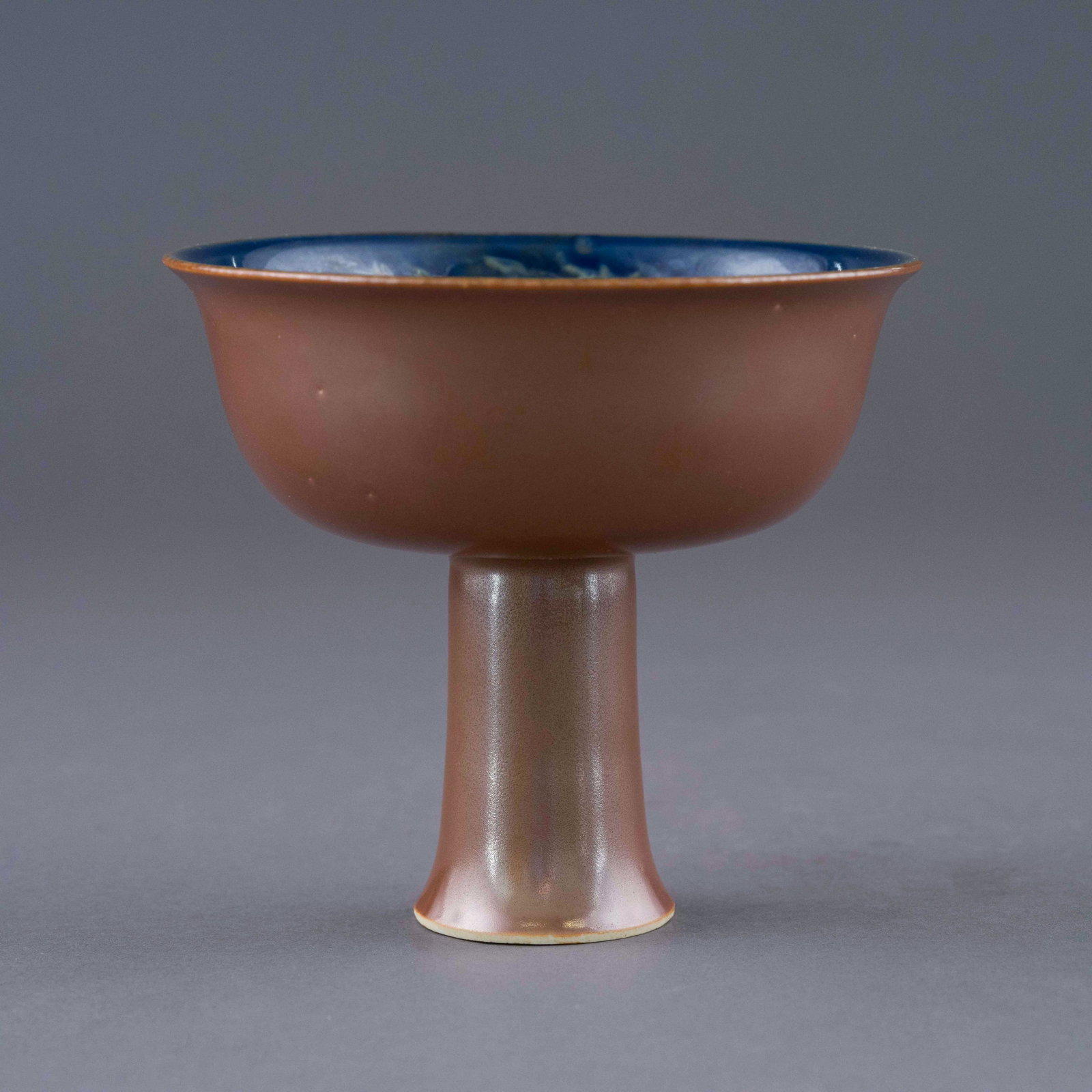 HONGWU ZIJIN GLAZED SGRAFITTO DRAGON HIGH BOWL: Chinese Ming Dynasty Period Hongwu Zijin glazed porcelain high bowl. The porcelain potted with a shallow body, of a shallow vessel, broad wide cavetto, with a straight opening lip, raised on a high sm