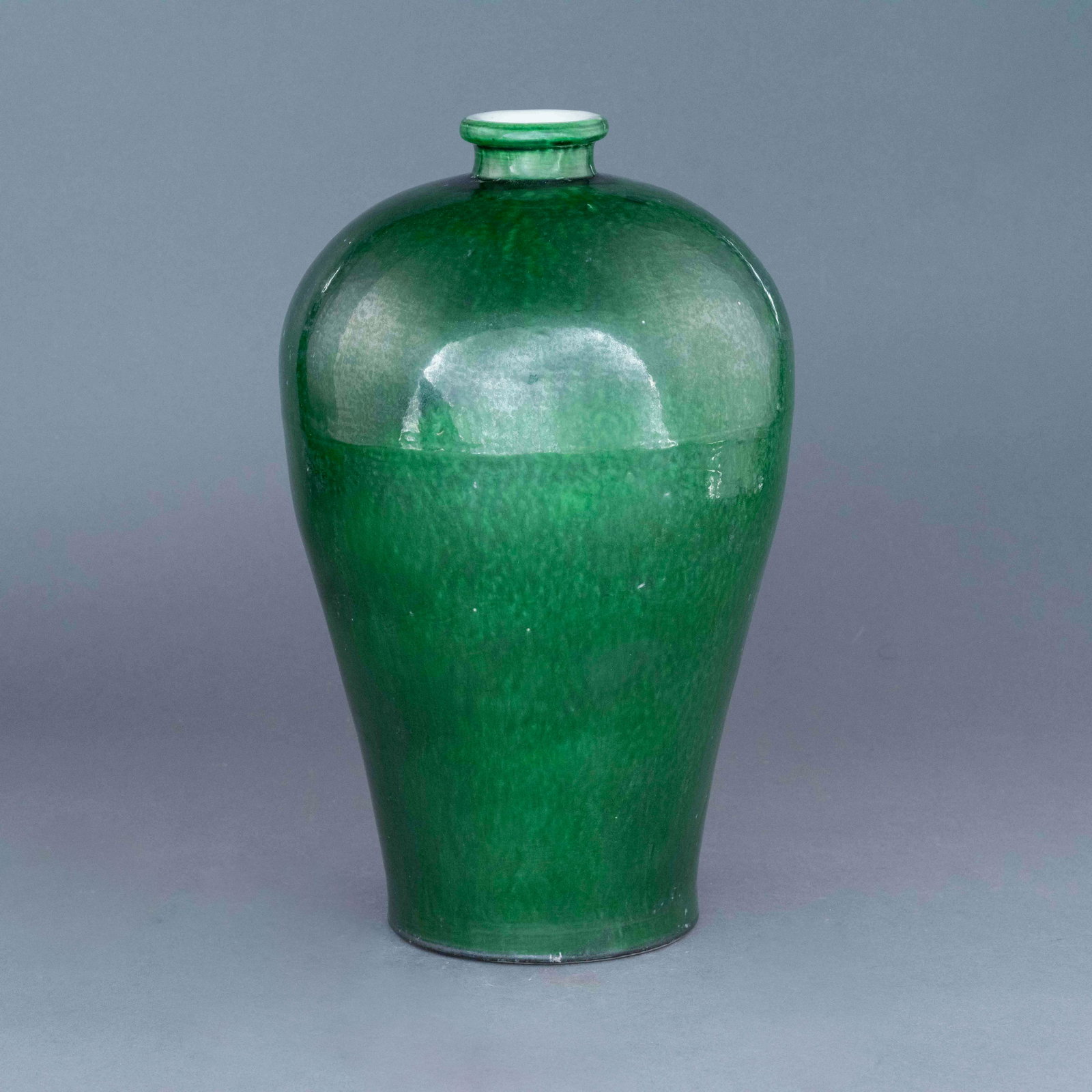 MING FAMILLE VERTE MONOCHROME MEIPING JAR: Chinese Ming Dynasty Period, famille verte monochrome Meiping jar. The porcelain shaped into a traditional Meiping form, thick potted, with a narrow base, wide body, slender neck easing to form a peti