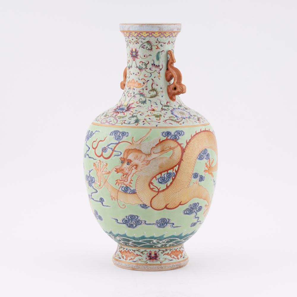 QIANLONG FAMILLE ROSE AMPHORA VASE: Measurements: Height: 15.25" Width/Lenght: 8.125" Diameter/Depth: 8.125" Chinese Qing Dynasty Period, Qianlong dragon porcelain vase. Potted in shaped vase, large, thick and tall, globular body, sligh