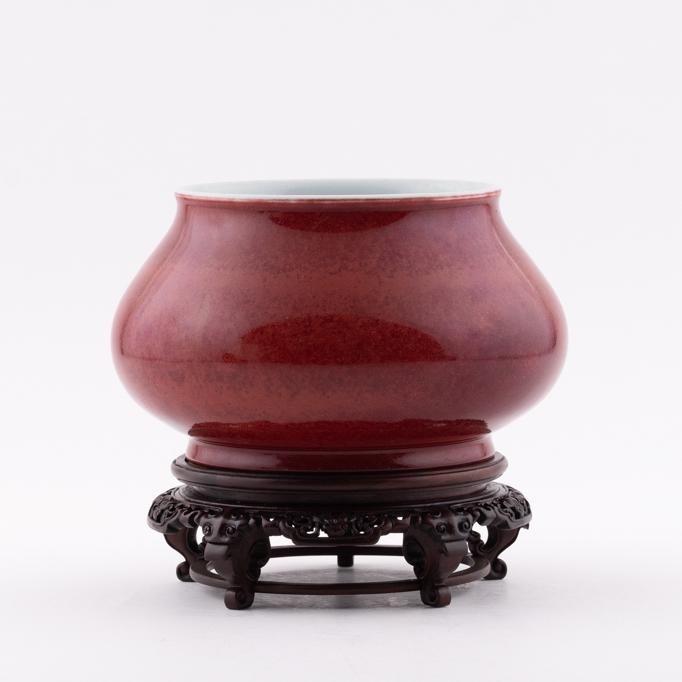 XUANDE RED MONOCHROME BRUSH WASHER ON STAND: Measurements: Height: 8.125" Width/Lenght: 8.375" Diameter/Depth: 8.375" Chinese Ming Dynasty Period, Xuande ruby red porcelain brush washer on stand. Potted in brush washer shape pot, globular body, 