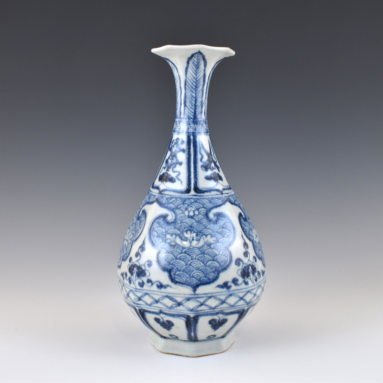 MING BLUE & WHITE PORCELAIN PEAR VASE: Measurements: Height: 10" Diameter: 4 7/8" Chinese Ming Dynasty blue and white porcelain pear vase. Delicately potted in bulbous body rising upwards to a thin waisted neck and barbed trumpet shaped ri