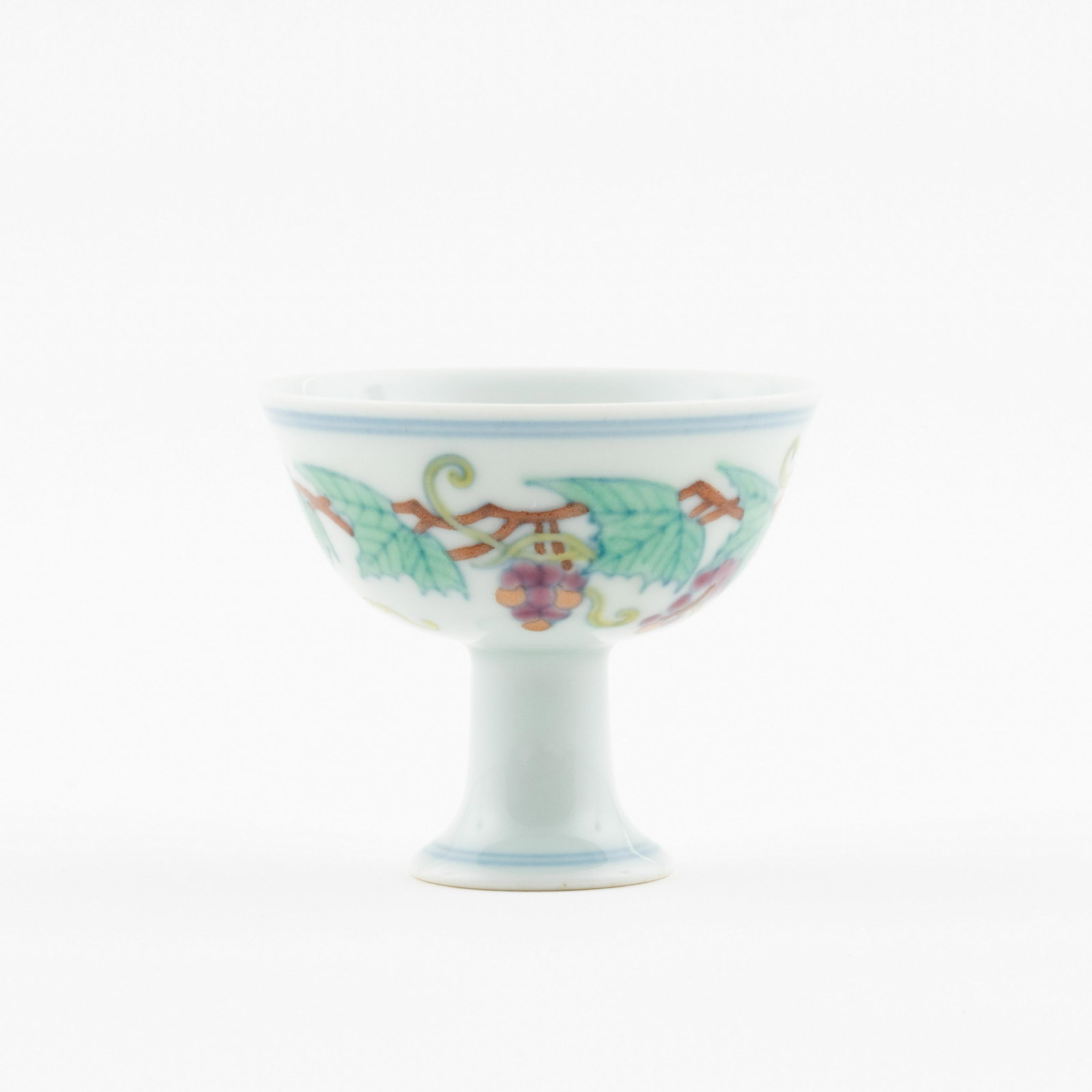 MING DOUCAI FRUTING GRAPES HIGH BOWL: Measurements: 2.625in x3.125in x 3.125in Chinese Ming Dynasty Period, Doucai fruiting grapes motif porcelain high bowl. Potted with a shallow body, slight deep, thick and bulbous body, with angled cav