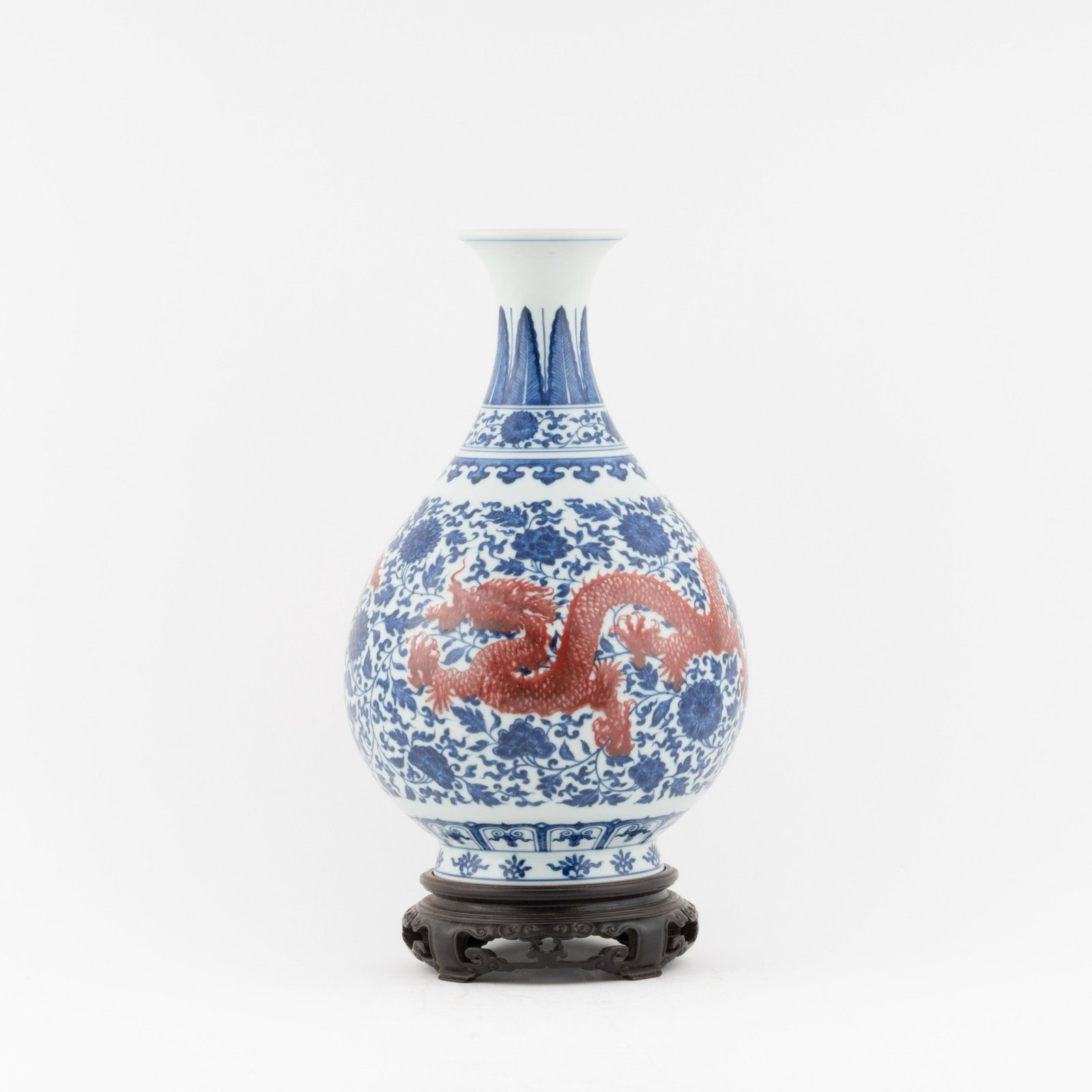 YONGZHENG RED DRAGON OVER BLUE WRAPPED FLORAL PEAR VASE: PROVENANCE: Stanley G Martin (1938-2019) of Marietta, GA . Stan attended High school in Albany, graduated from the University of Georgia and then entered the navy for 3 years. They moved to Atlanta wh