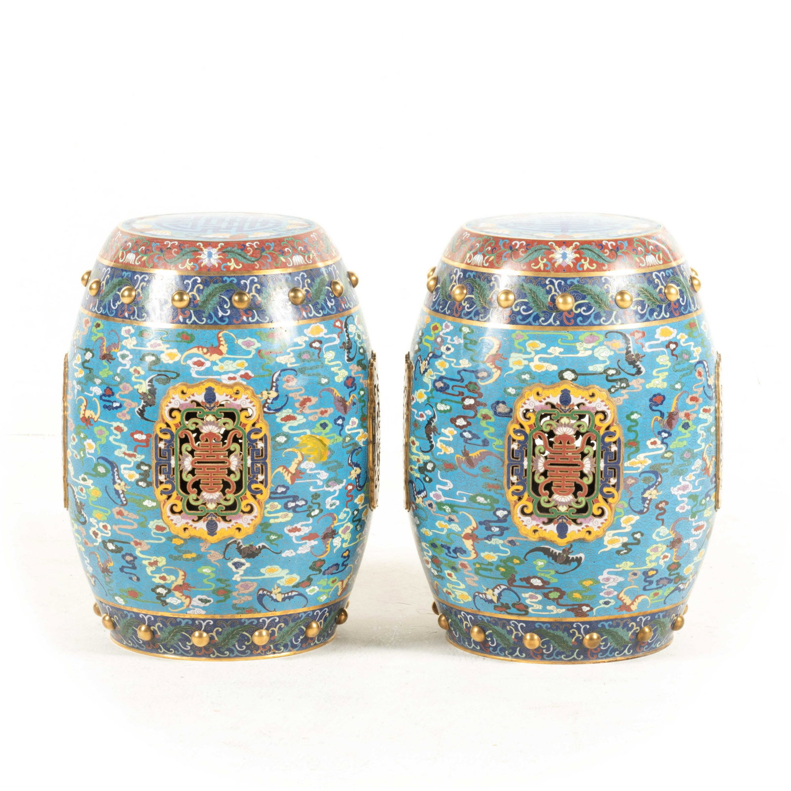 PAIR OF GILT BRONZE CLOISONNE GARDEN STOOLS: Measurements: 18in x13.5in x 13.5in Pair of Chinese Gilt Bronze Cloisonne Garden Stools. Pair of Qing Dynasty Chinese gilt bronze cloisonne enamel garden stool, stoutly repoussed in barrel shaped body