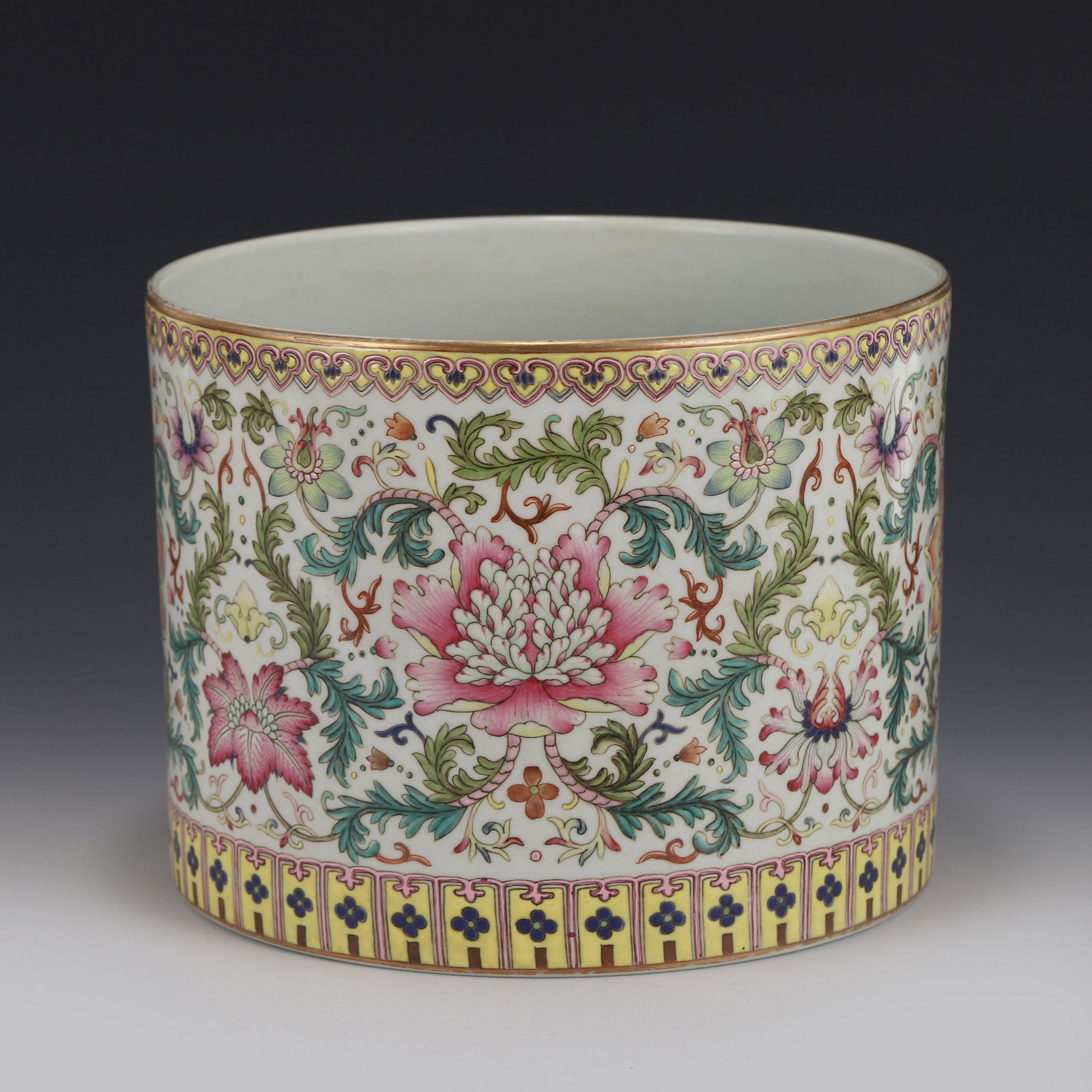 FAMILLE ROSE FLOWER BRUSH POT: Measurements: Height: 16.2 cm Diam: 21.5 cm Chinese Qing Dynasty Period, YongZheng Famille Rose flower porcelain brush pot. The Porcelain potted in brush holder shape, sturdily in cylindrical straight