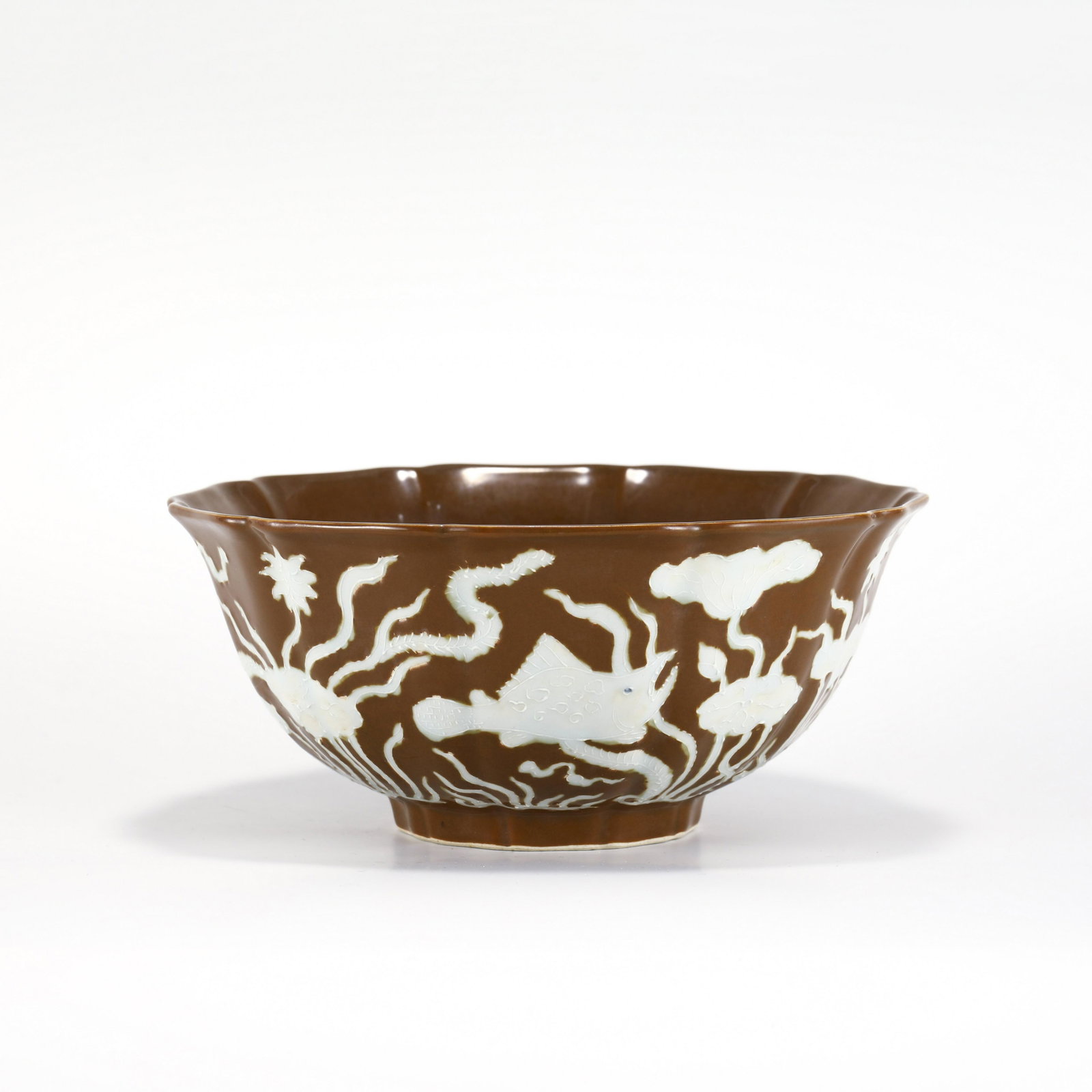 MING WHITE & GOLD GLAZED BOWL: PROVENANCE: Hattiesburg, Mississippi, Private collector. Dimensions: Height: 10 cm, Diam: 23 cm Chinese Ming Dynasty White and Gold Glazed Porcelain Bowl. The porcelain potted with a shallow body, sli