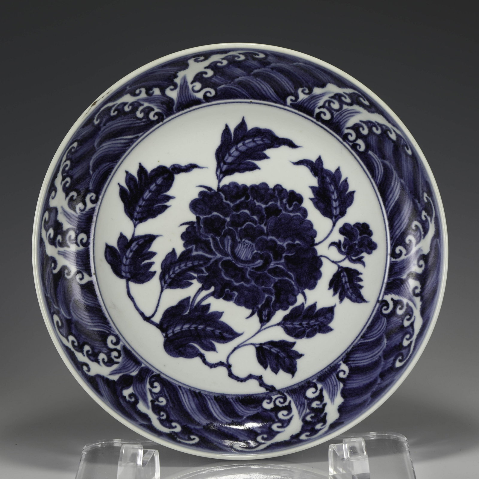 MING BLUE & WHITE PEONY PLATE: Measurements: Width: 43.5cm, Height: 7cm Chinese Ming Dynasty Blue and White Porcelain Plate. The plate has a broad wide central interior, rounded mouth lip, thick and large, raised on correspondence 