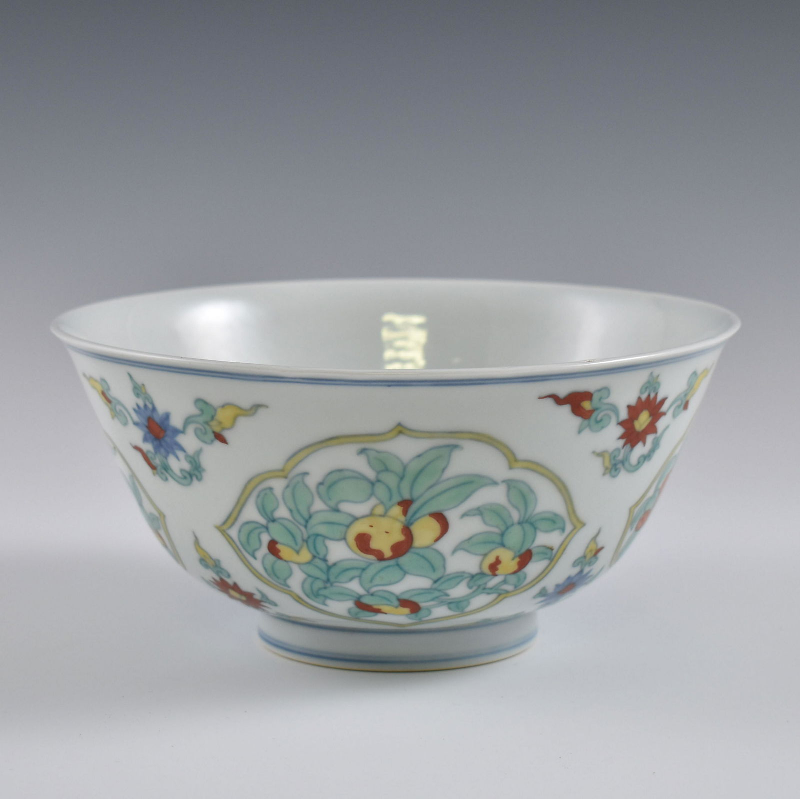 MING CHENGHUA DOUCAI FRUIT ABUNDANT BOWL: Dimensions: 4" H x 8-1/4" Dia. Chinese Ming Dynasty Period, ChengHua doucai fruit abundant bowl. Potted with a shallow body, slight deep, thick and bulbous body, with angled cavetto elevated the steep
