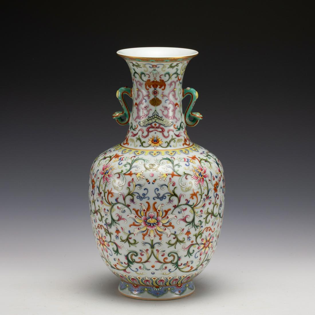 FAMILLE ROSE LOTUS AMPHORA VASE: Measurements: Width: 17.8 cm, Height: 31.9 cm Chinese Famille Rose Lotus Porcelain Amphora Vase. This vase has a flaring mouth-rim, a long cylindrical neck, a sloping shoulder with Lingzi fungus head 