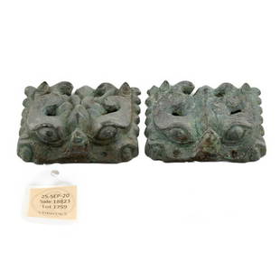 A PAIR OF BRONZE TAOTIE MASKS SIX DYNASTIES PERIOD (AD 220-589): Measurements: 2.75 in. (7 cm.) wide, cloth box PROVENANCE: Acquired from CHRISTIE'S March 2021, Sale 18823, Chen Hui-Lin, 15 April 1988. The Irving Collection, New York. Lot# 1759 A PAIR OF BRONZE TAO